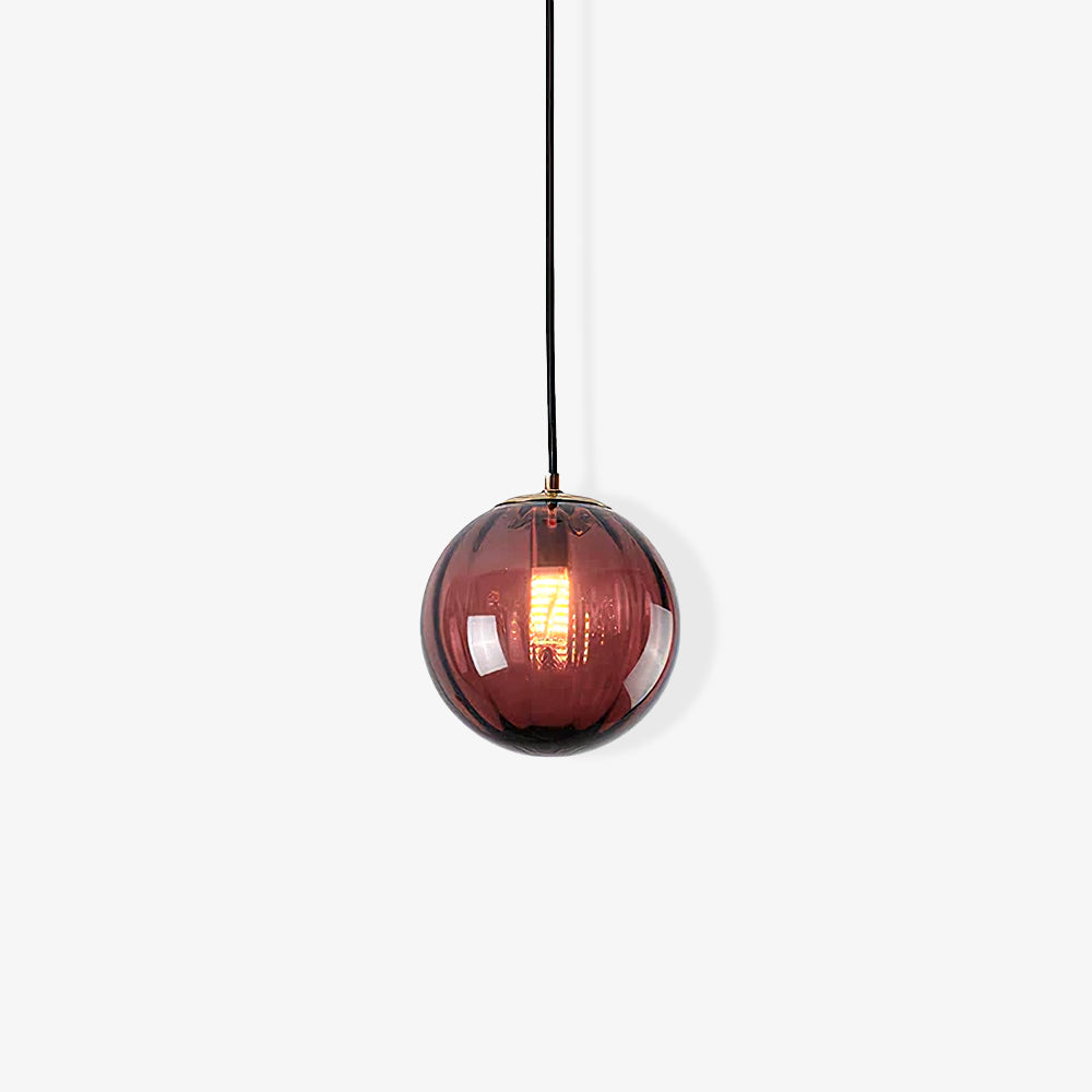 Paola pendant light with a coloured glass globe and small metal cap