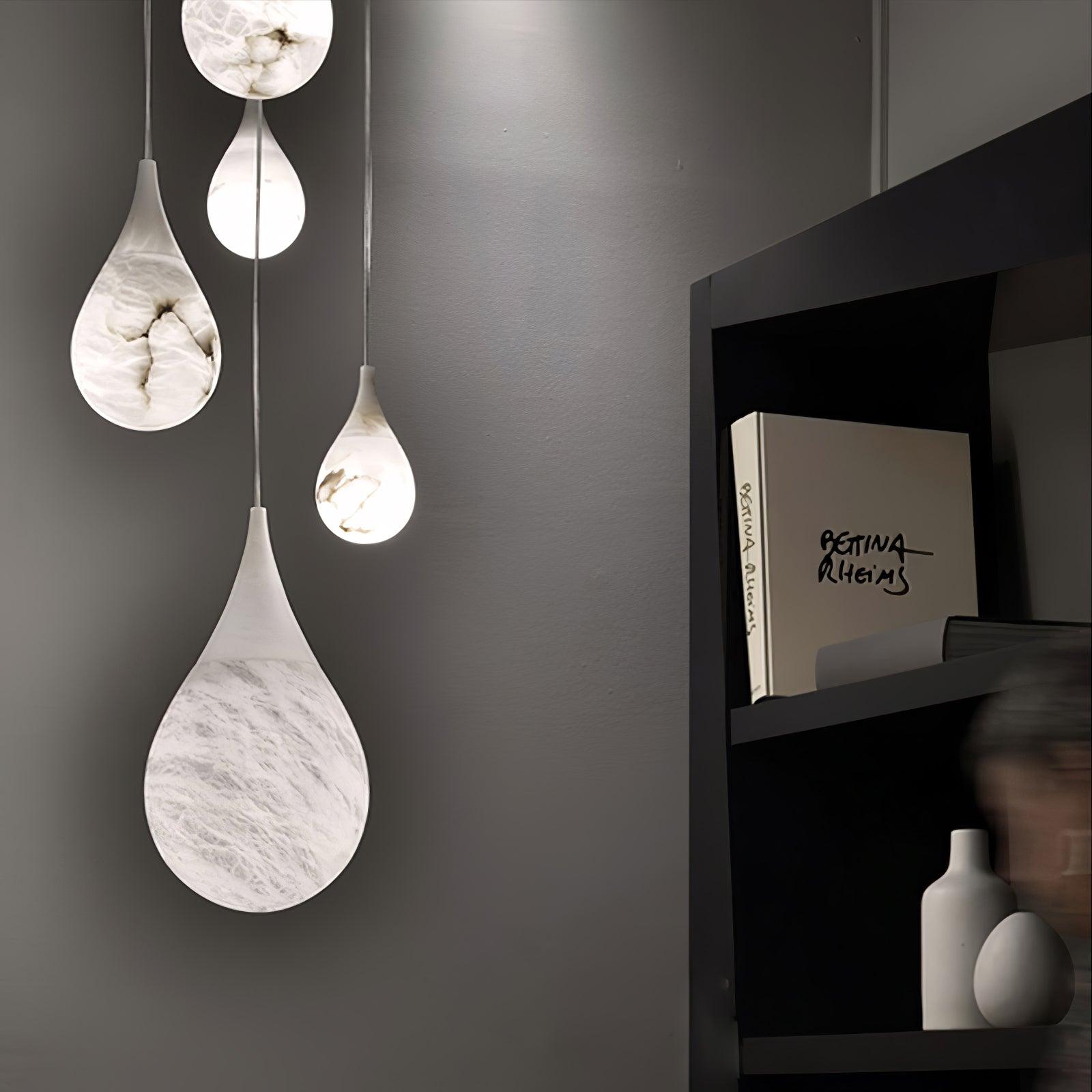 Hanging marble teardrops beside wall shelves