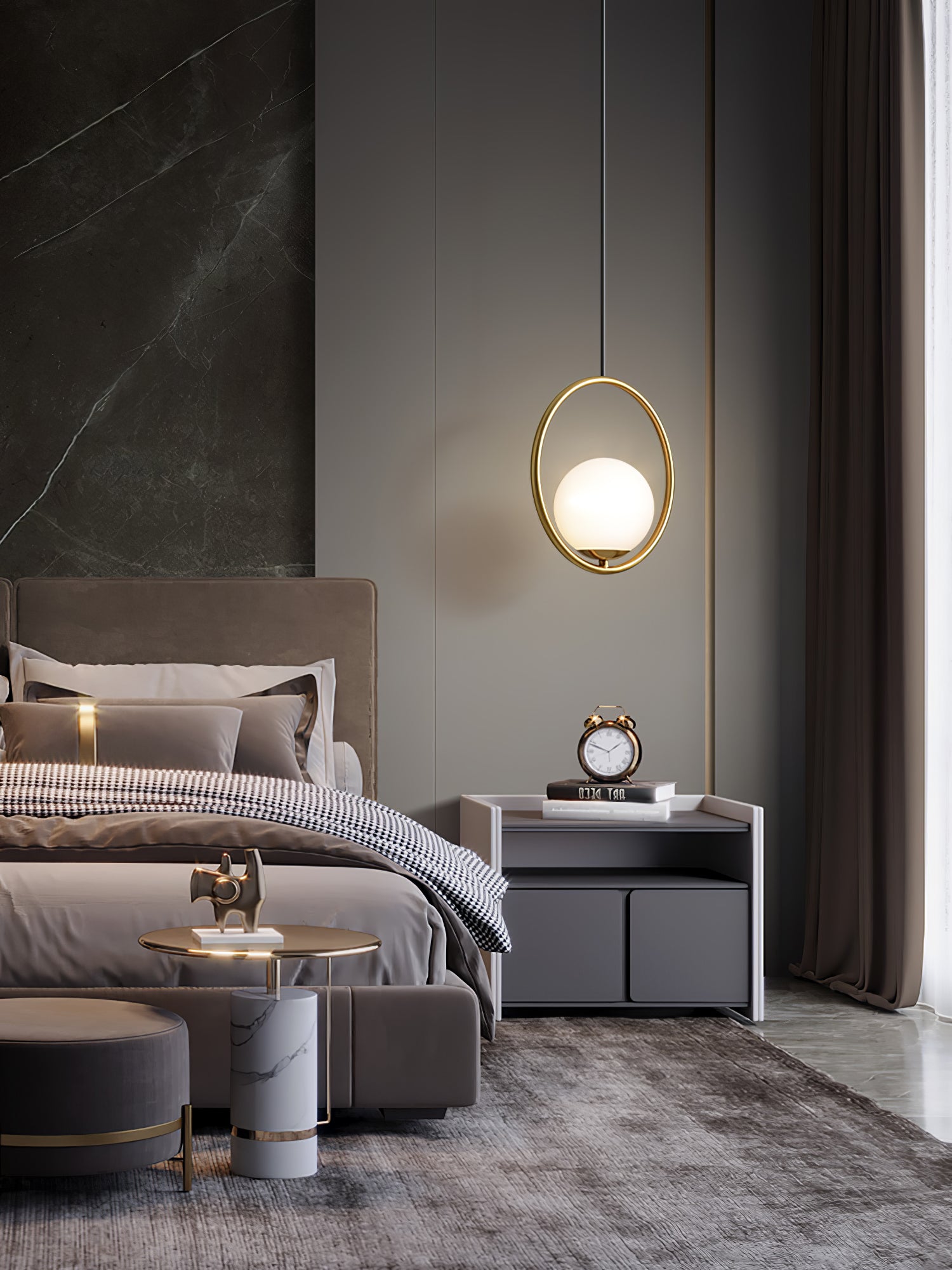 Circular globe pendant above a bedside table