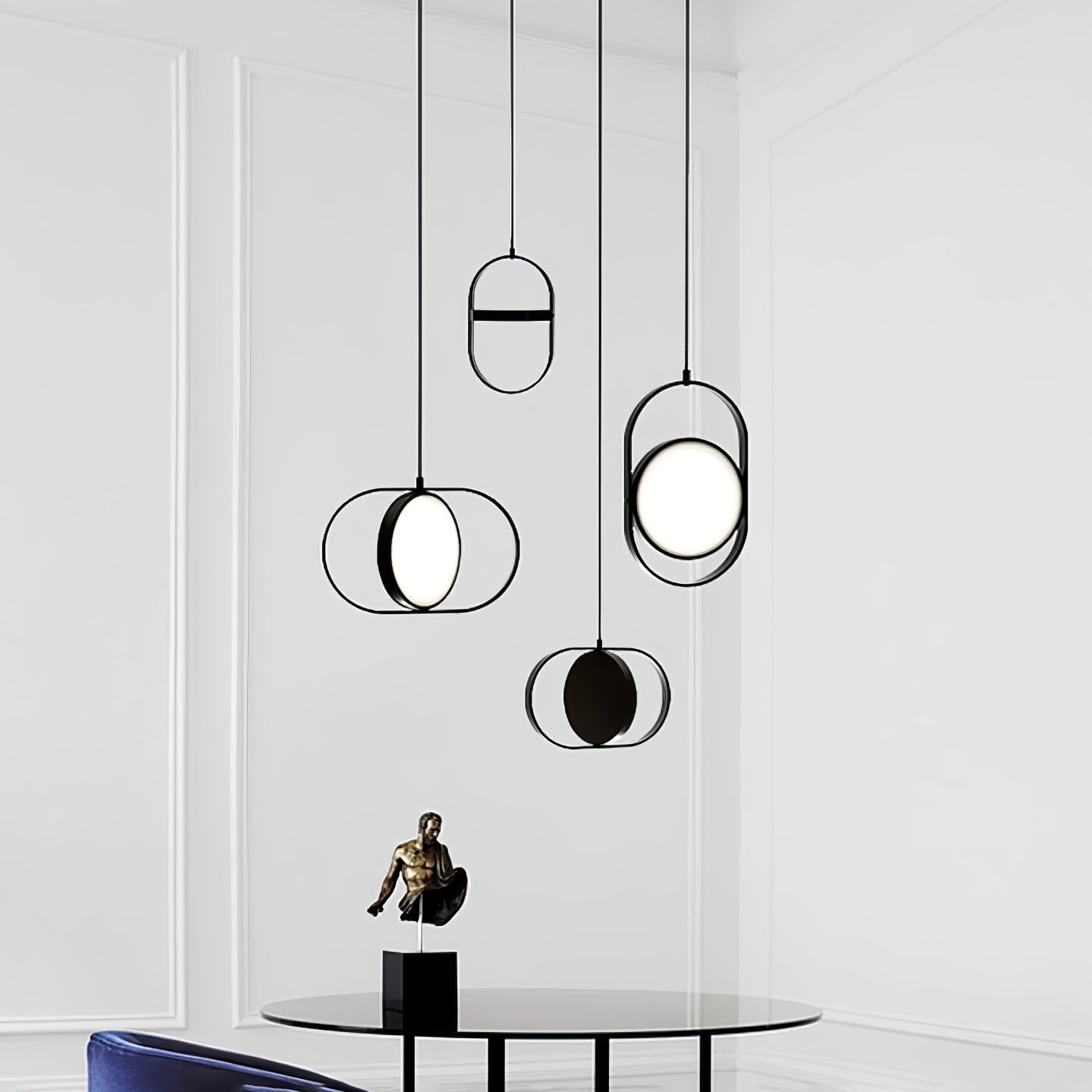 Black KUU pendants beside a dining table