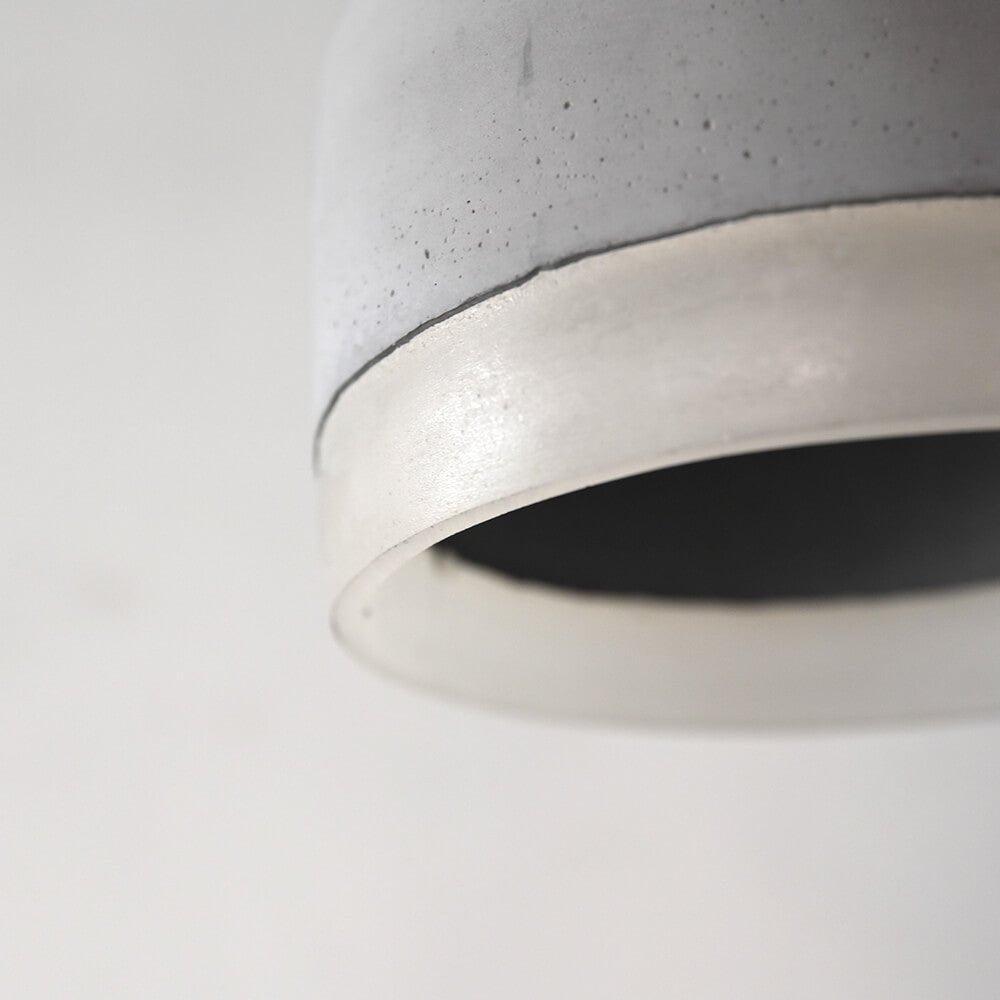 Close view of textured grey surface and translucent lower band