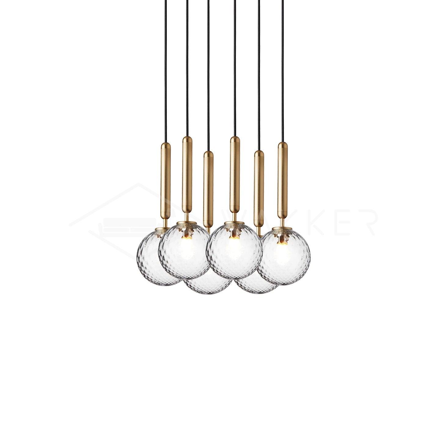 Closely grouped clear globes with brass stems