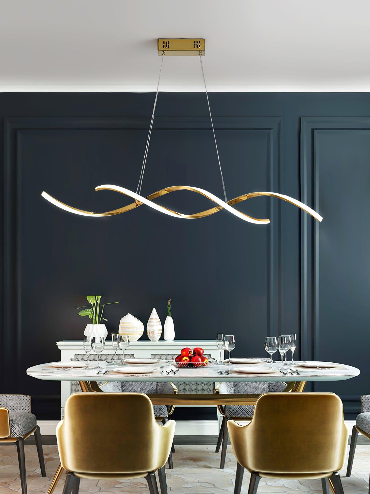 Gold wave pendant above an oval white dining table with yellow chairs and a dark blue wall