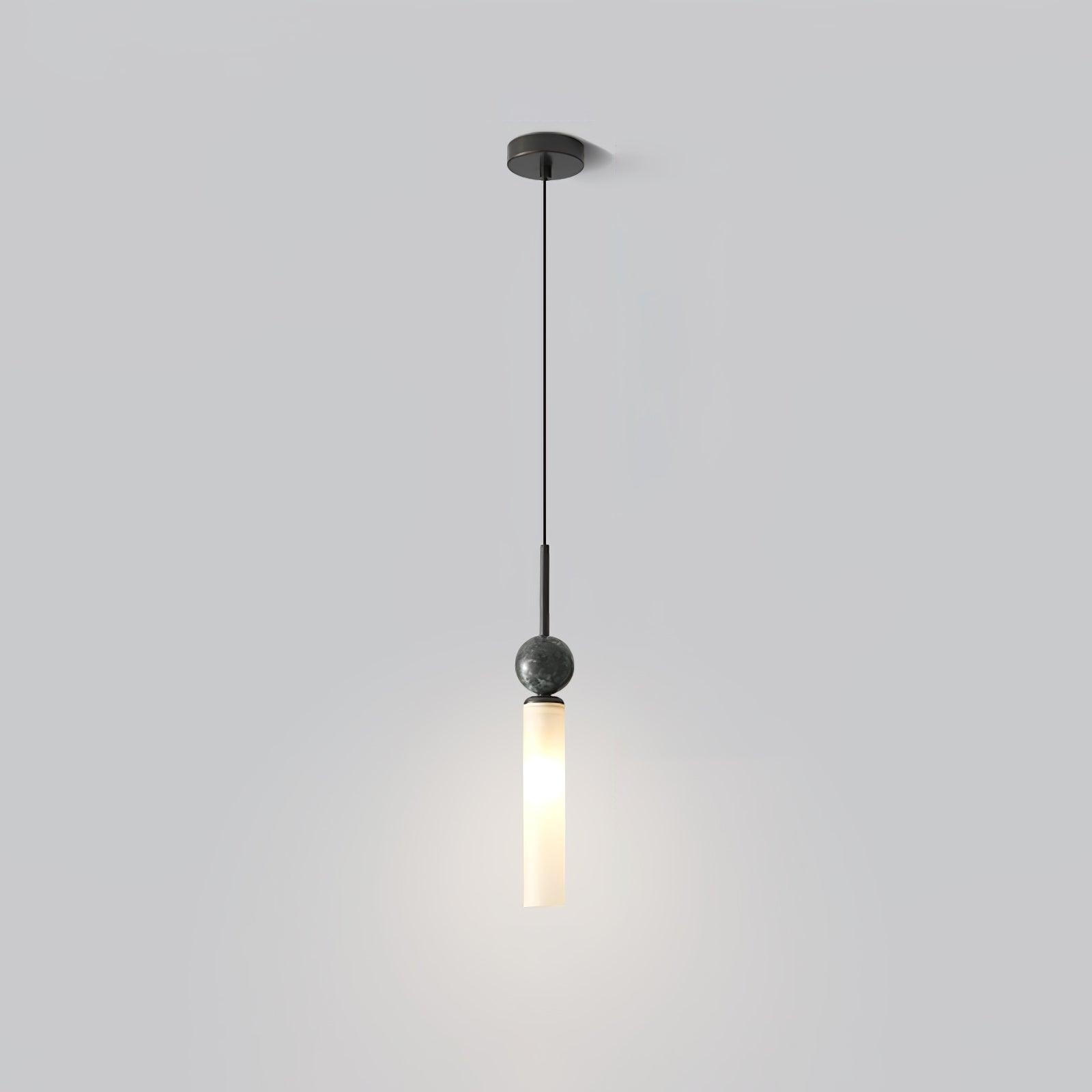 Black single pendant with round canopy, long cable, veined dark sphere and glowing white tube against pale wall