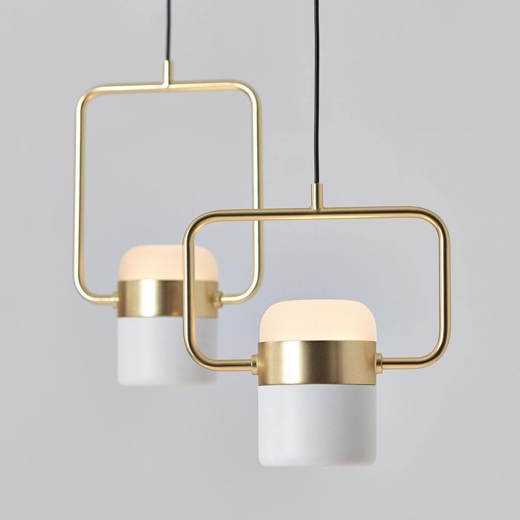 Horizontal and vertical gold-tone pendant frames with white light heads