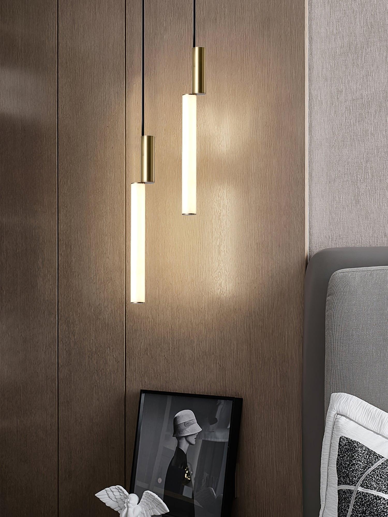Two Gold-and-White light bars beside a bed