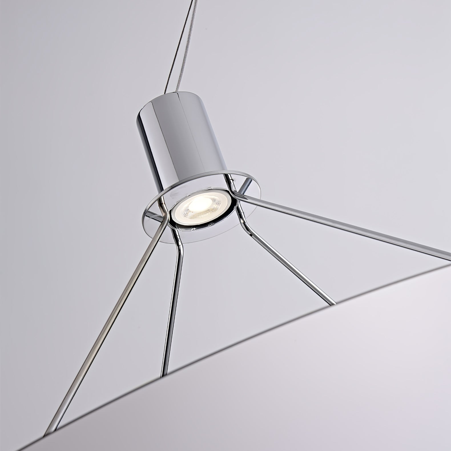 Chrome LED head facing its reflector disc