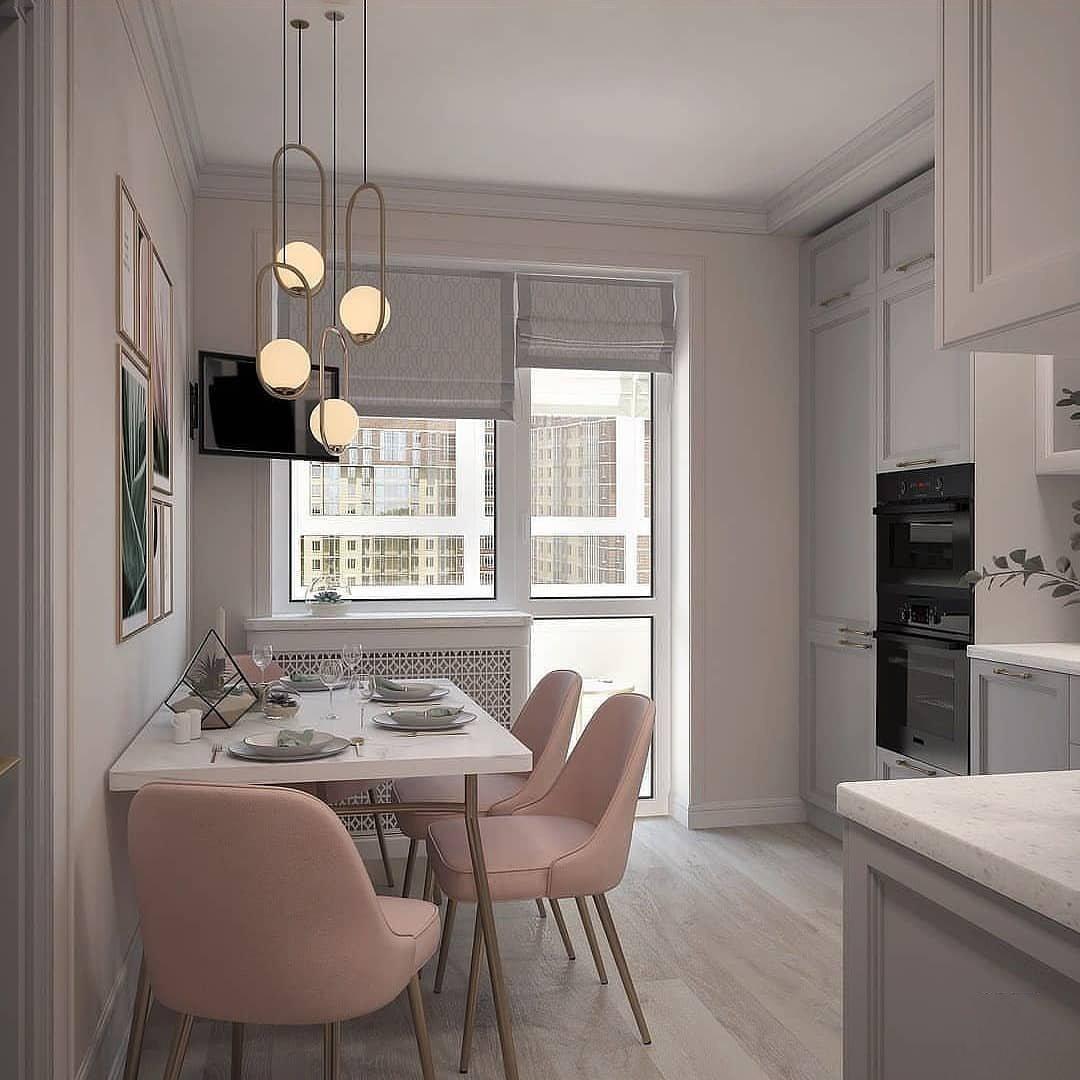 Grouped oval frame pendants above a dining table