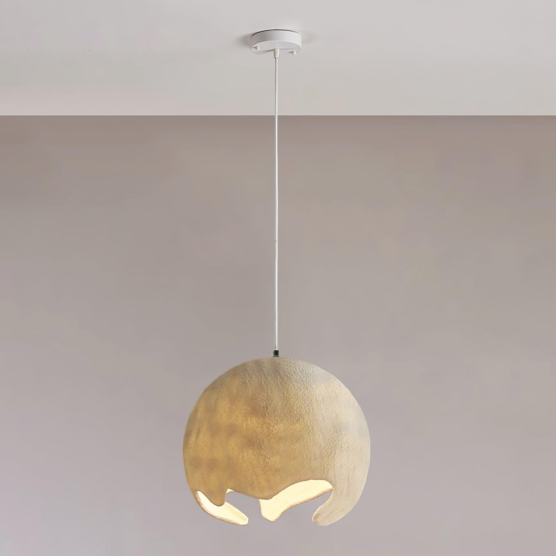 Large beige textured globe pendant with pale suspension