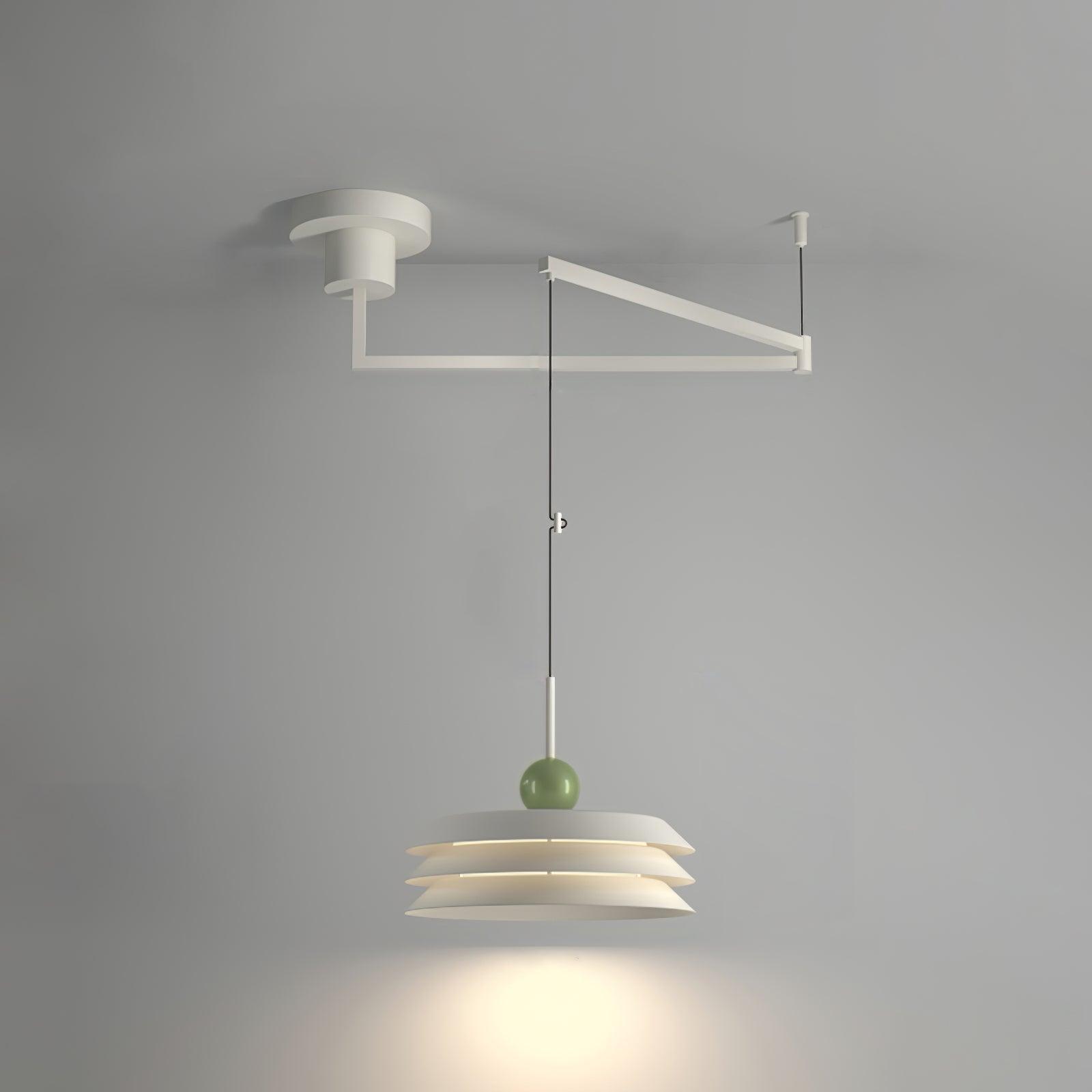 White three-tier Morandi pendant with a green sphere on a white ceiling swing arm