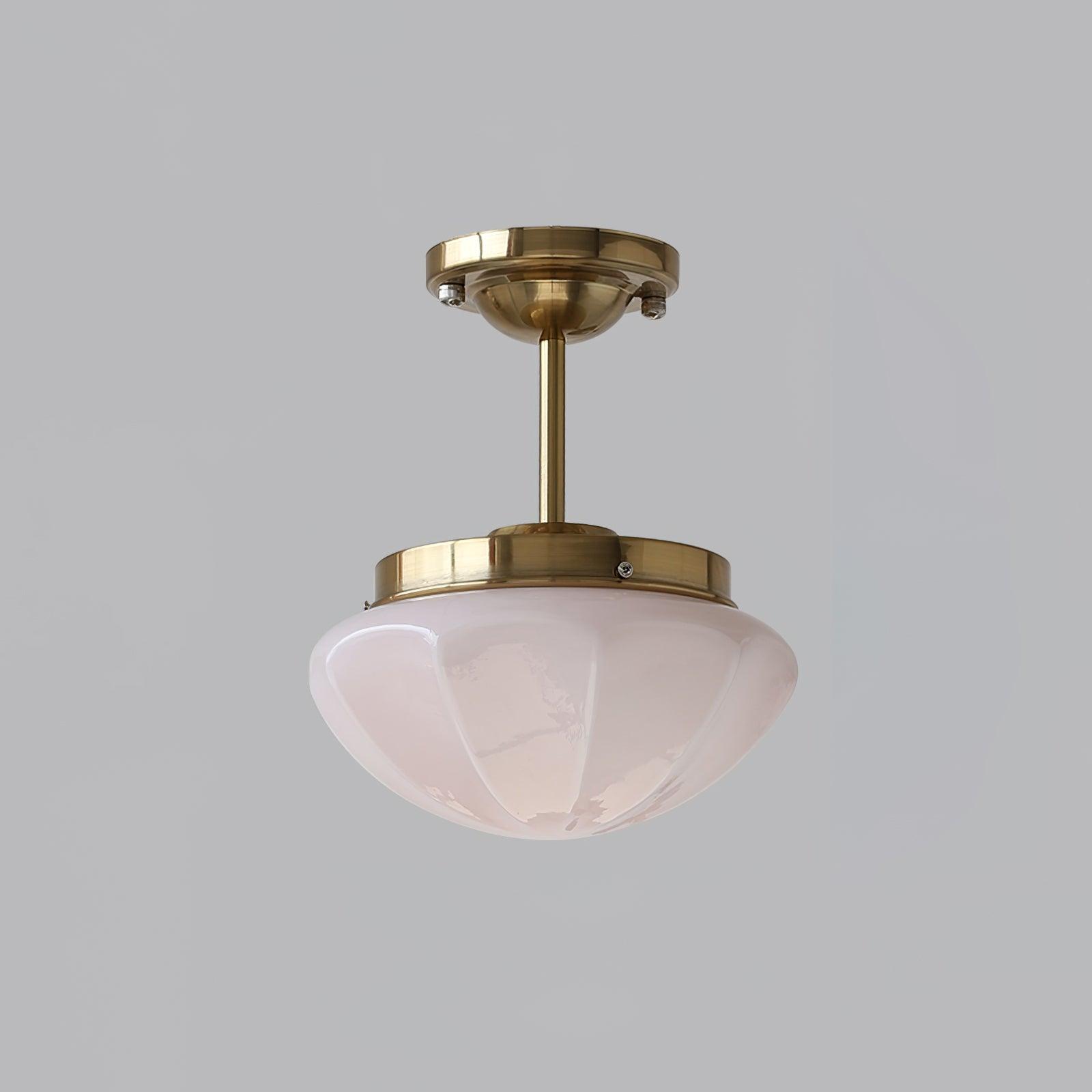 Pink faceted glass bowl on a gold-tone fitting with a longer stem