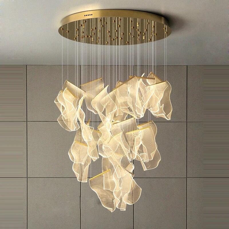 Illuminated twenty-eight-head acrylic chandelier below a gold-coloured ceiling canopy