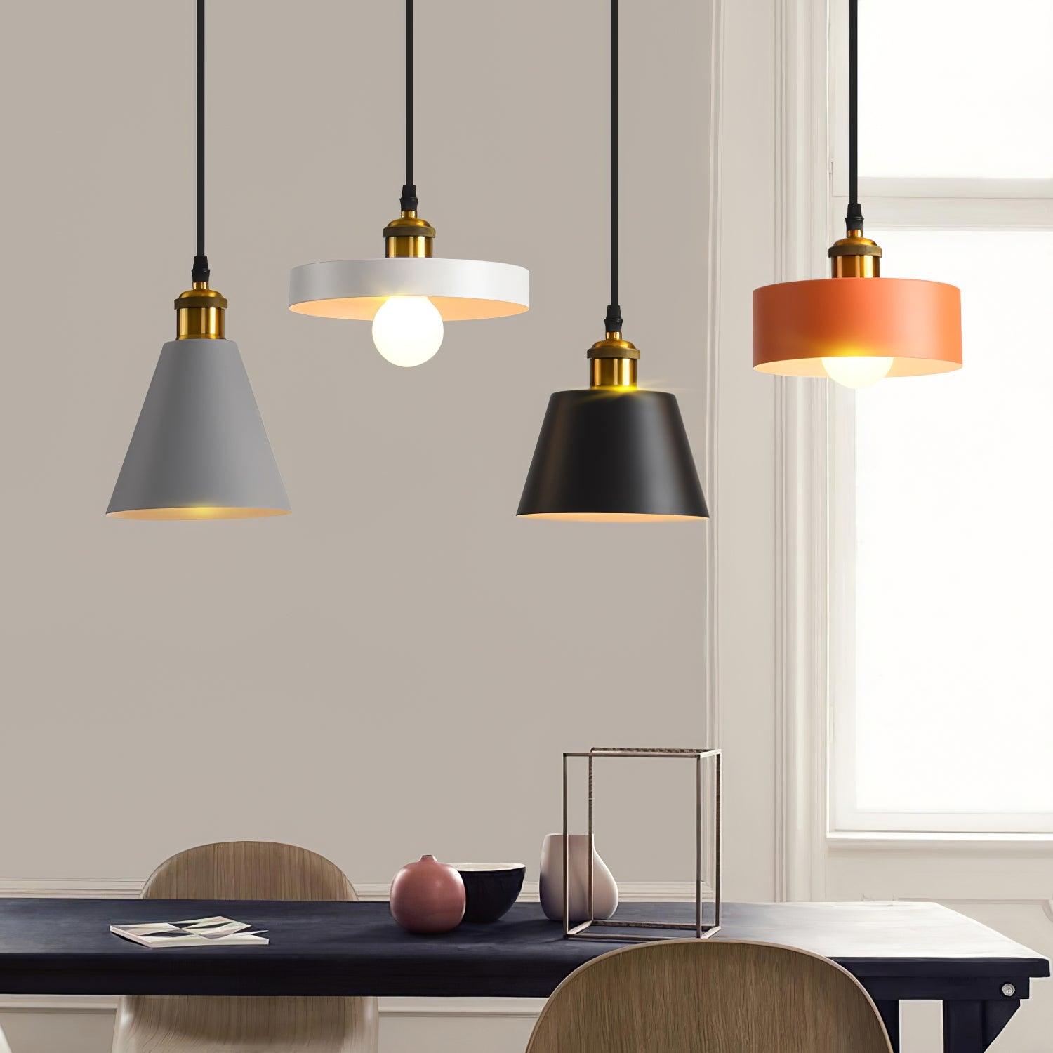 Cone and disc pendants above a table