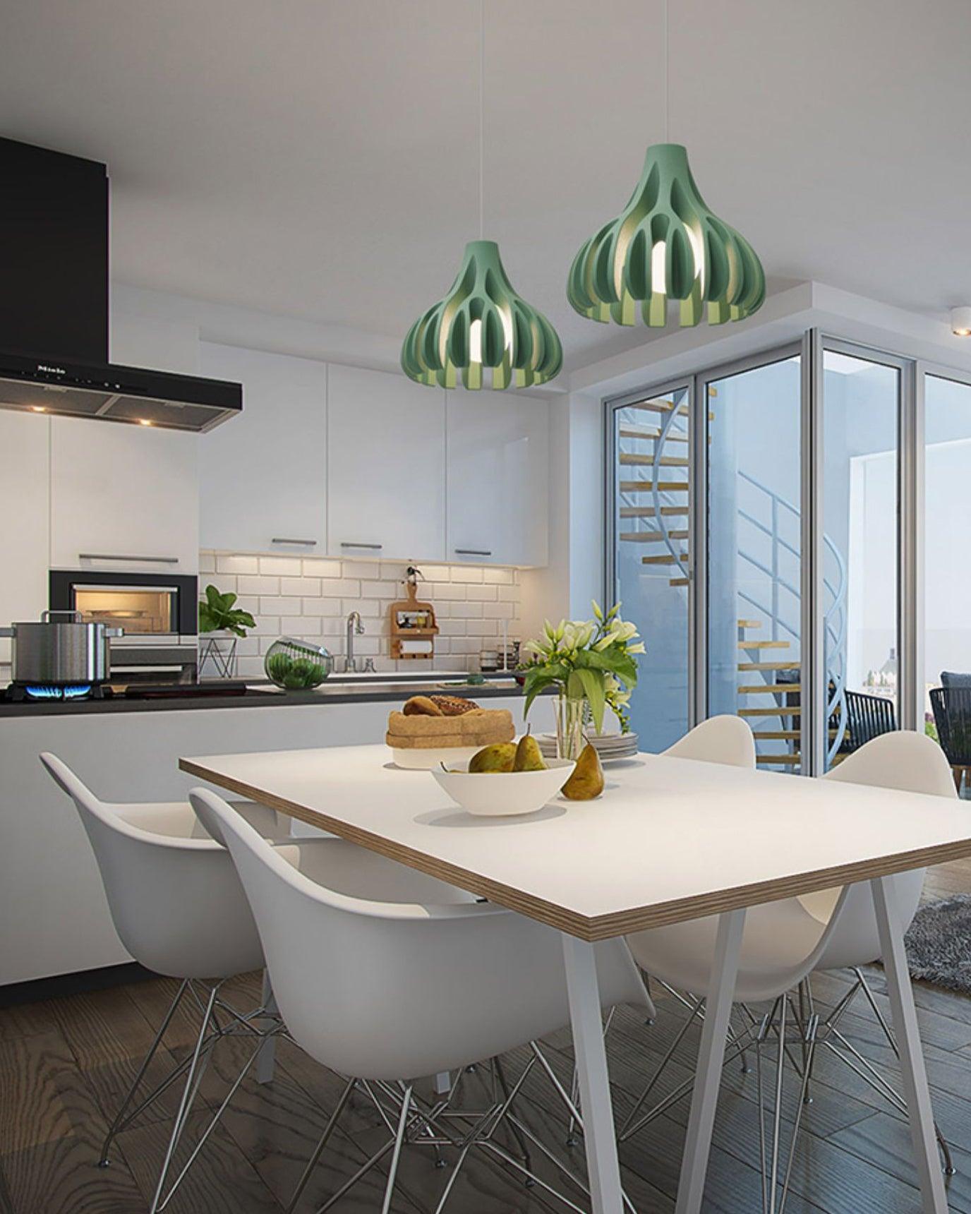 Two Green resin pendants above a dining table