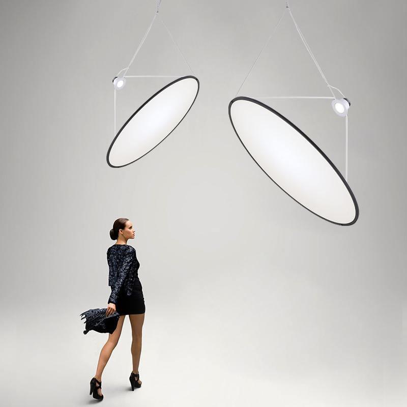 Large white disc pendants shown at an angle