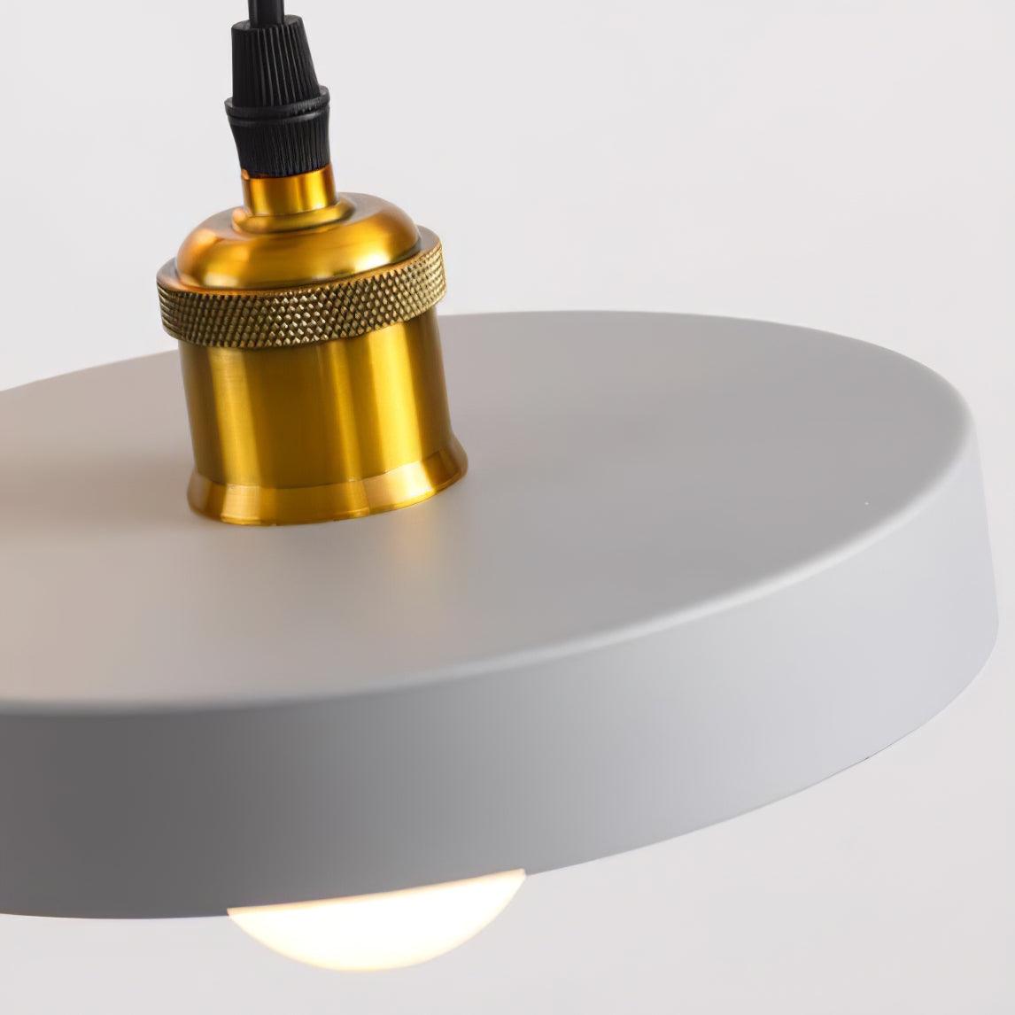 Close-up of gold-coloured fitting on a grey disc