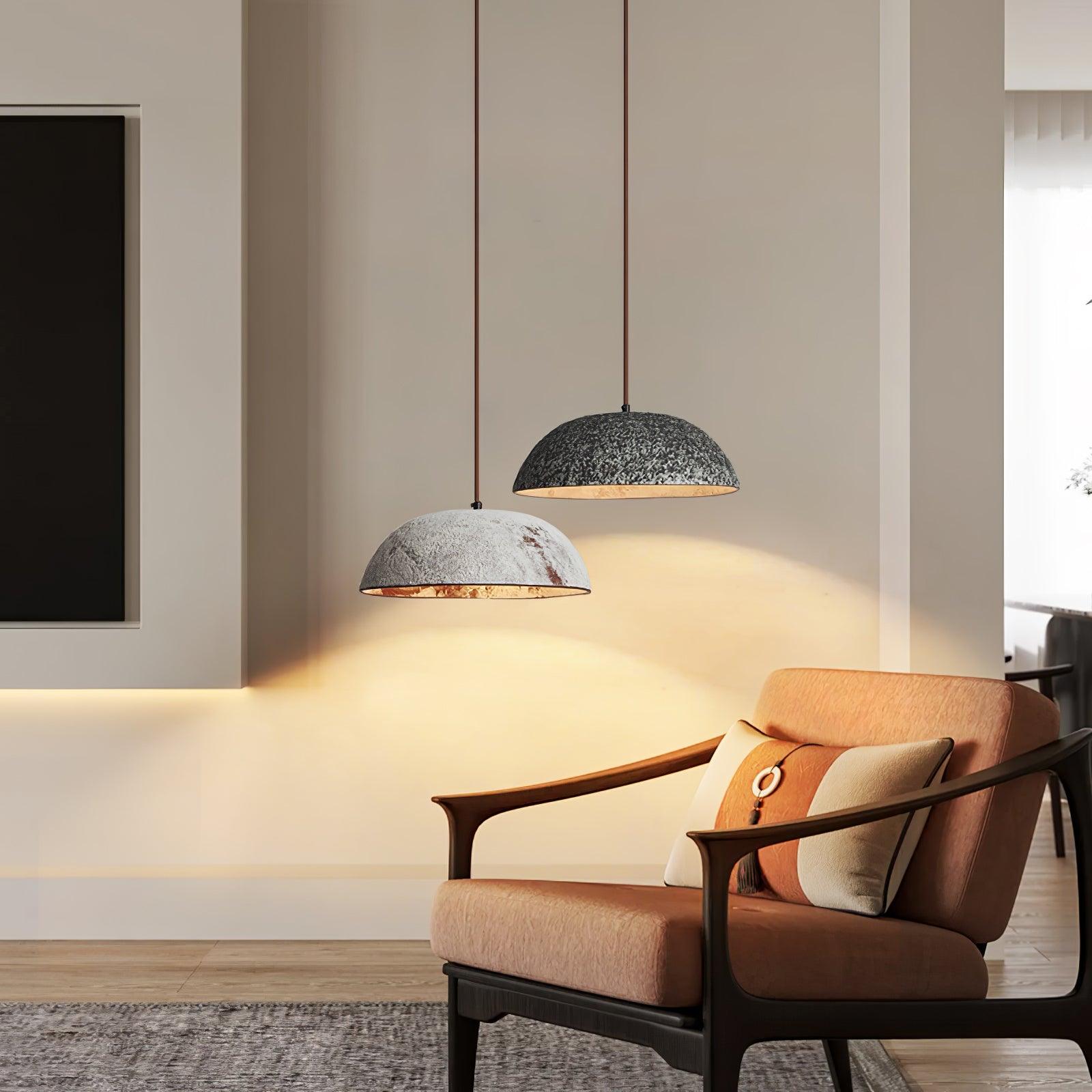 Black and White dome pendants beside an armchair