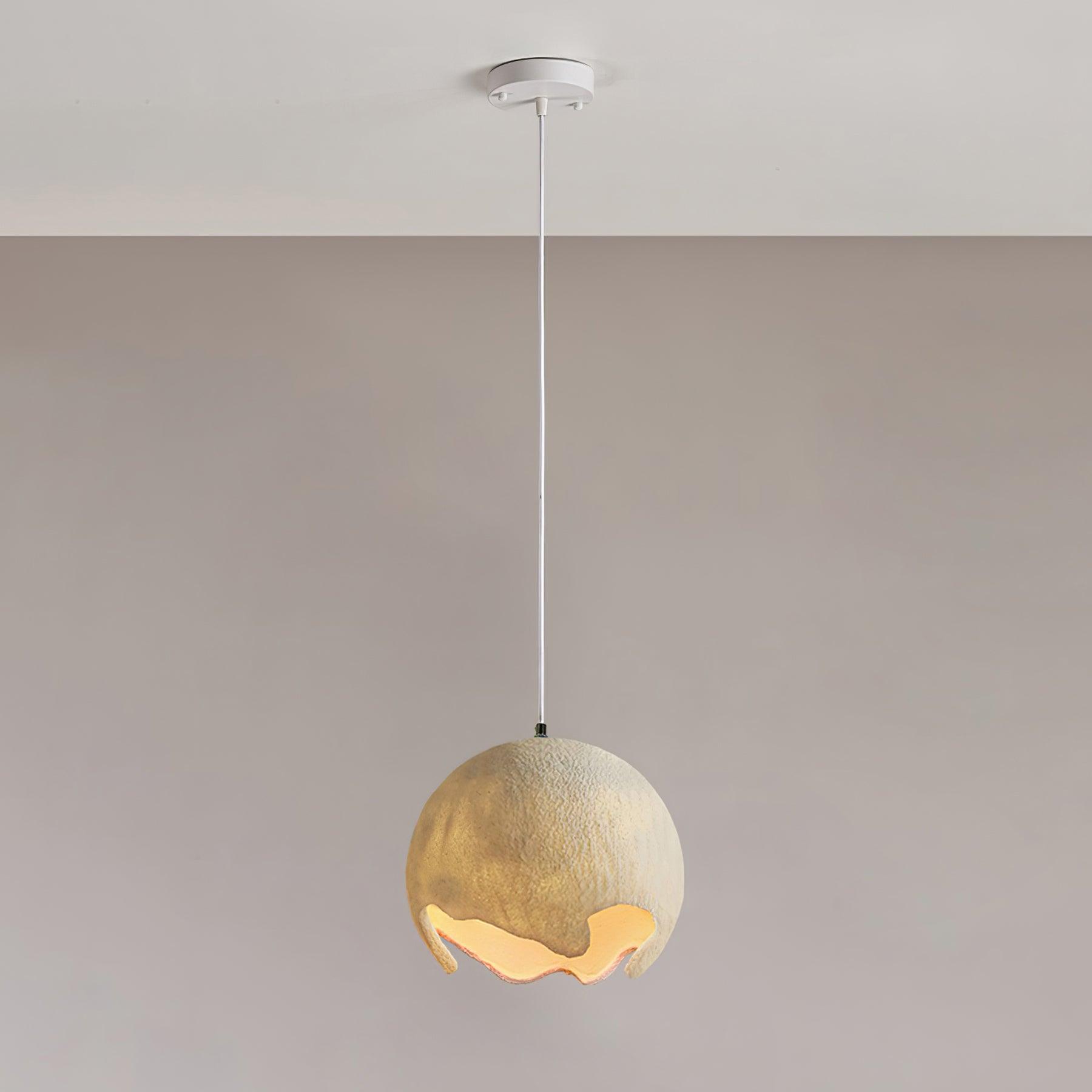 Beige textured globe pendant with an uneven illuminated opening