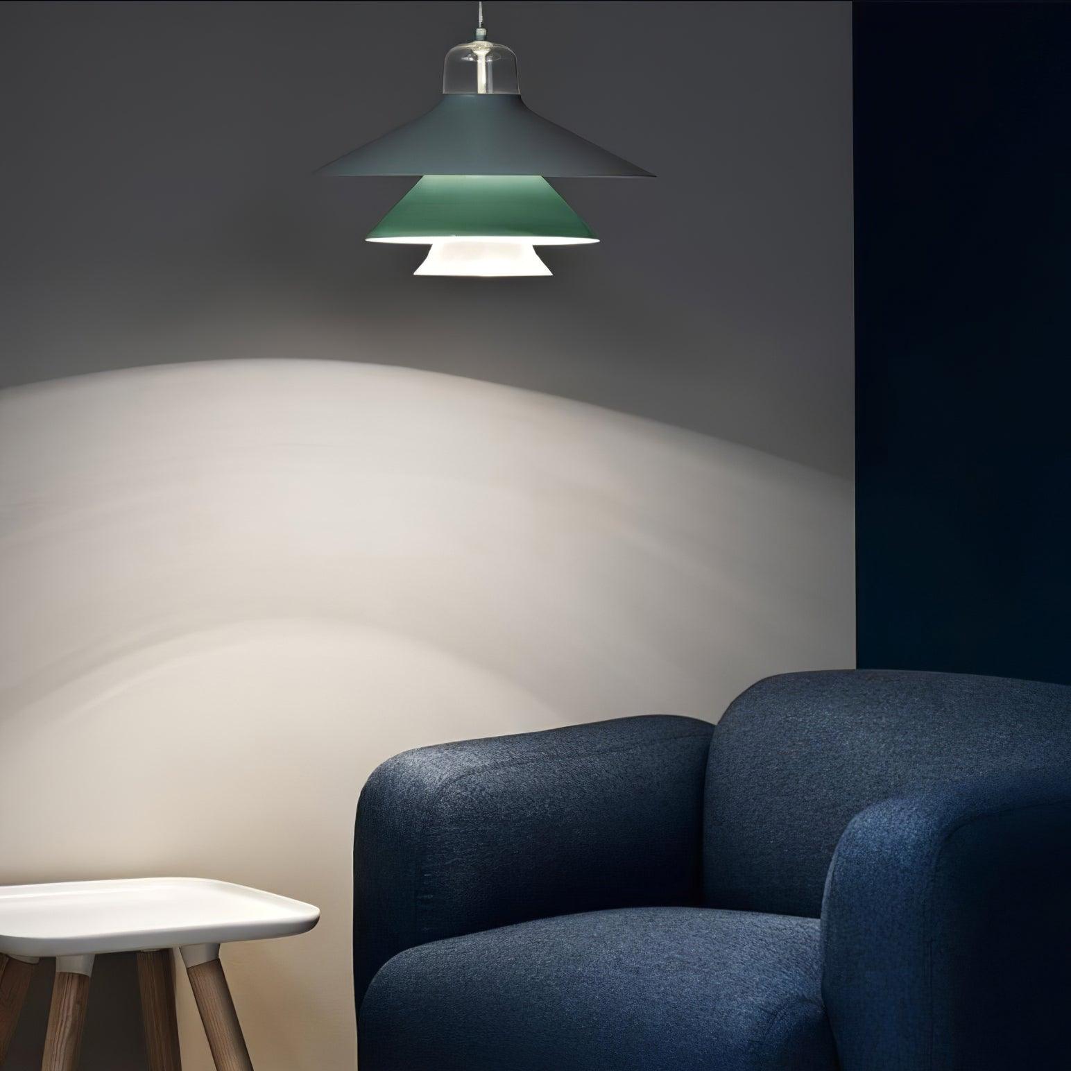 Green pendant above a lounge chair