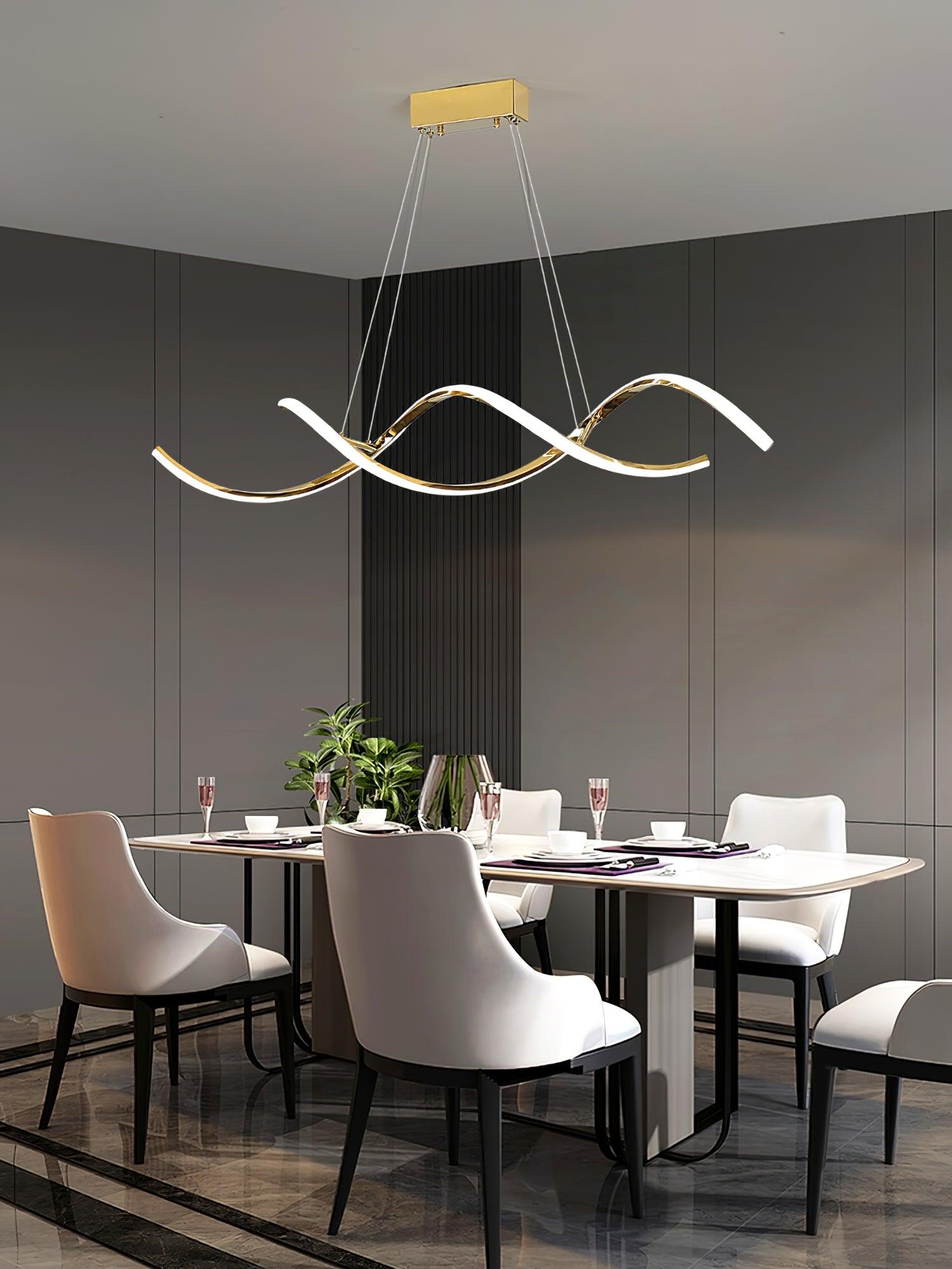 Oblique gold wave pendant above a set dining table with white chairs