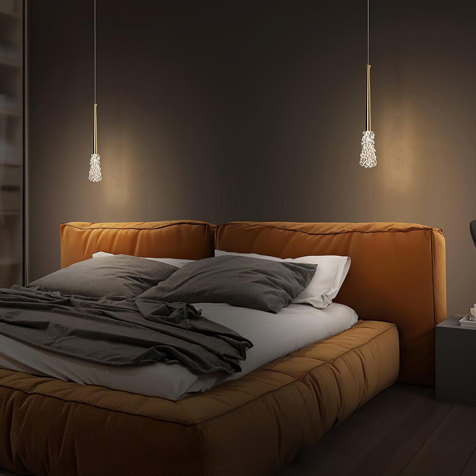 Two single Gold pendants in a bedroom