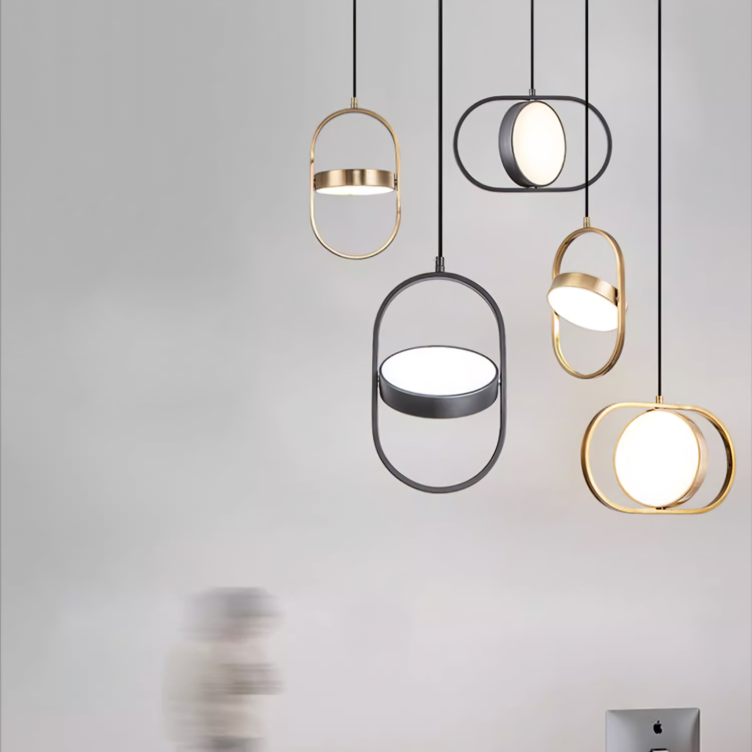 Gold and Black oval pendants shown together