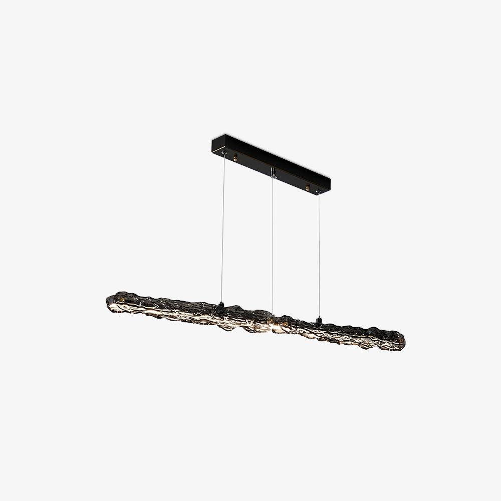 Dark wavy textured linear pendant with illuminated underside and black rectangular canopy on white