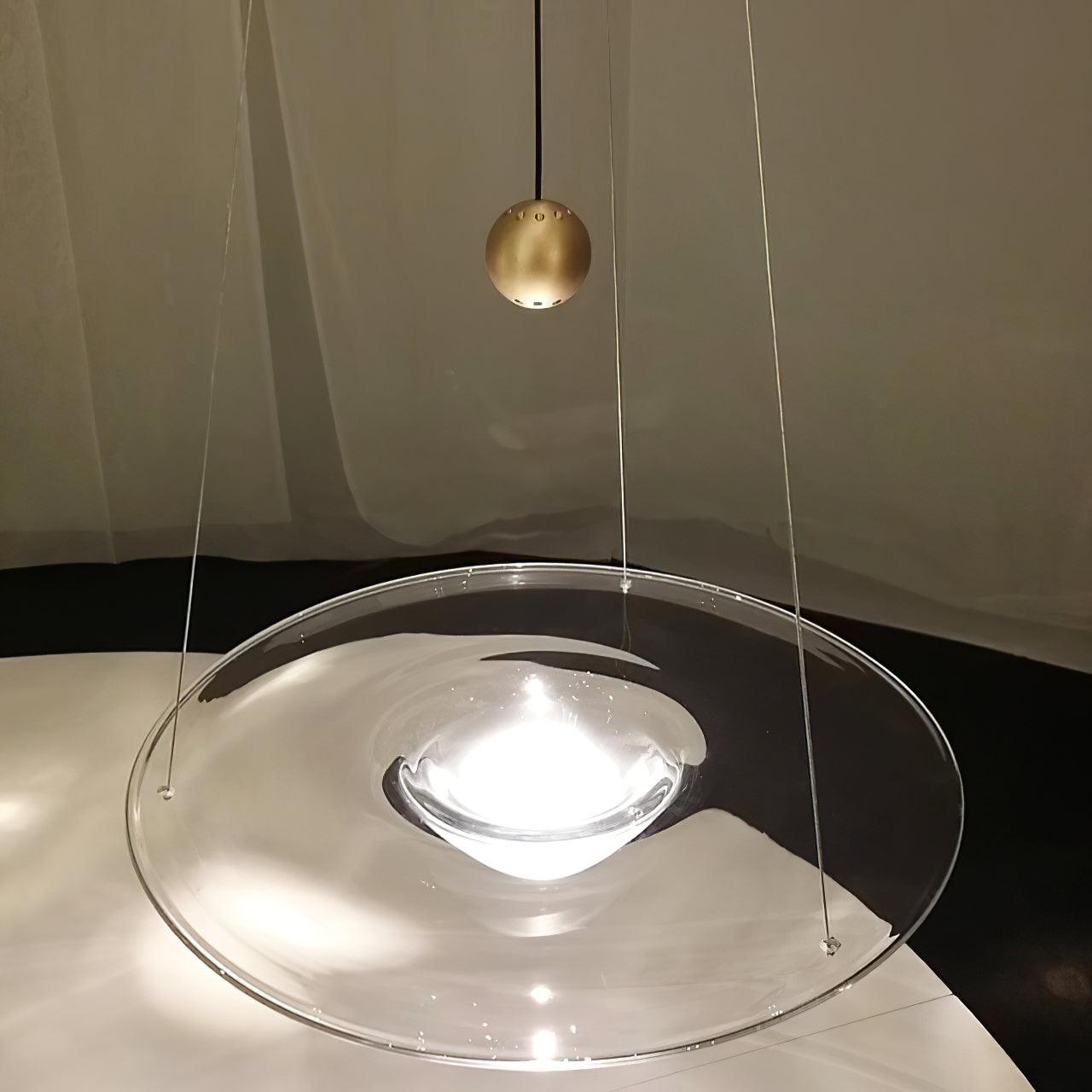 Close-up of clear disc, central bowl and brass-coloured bead