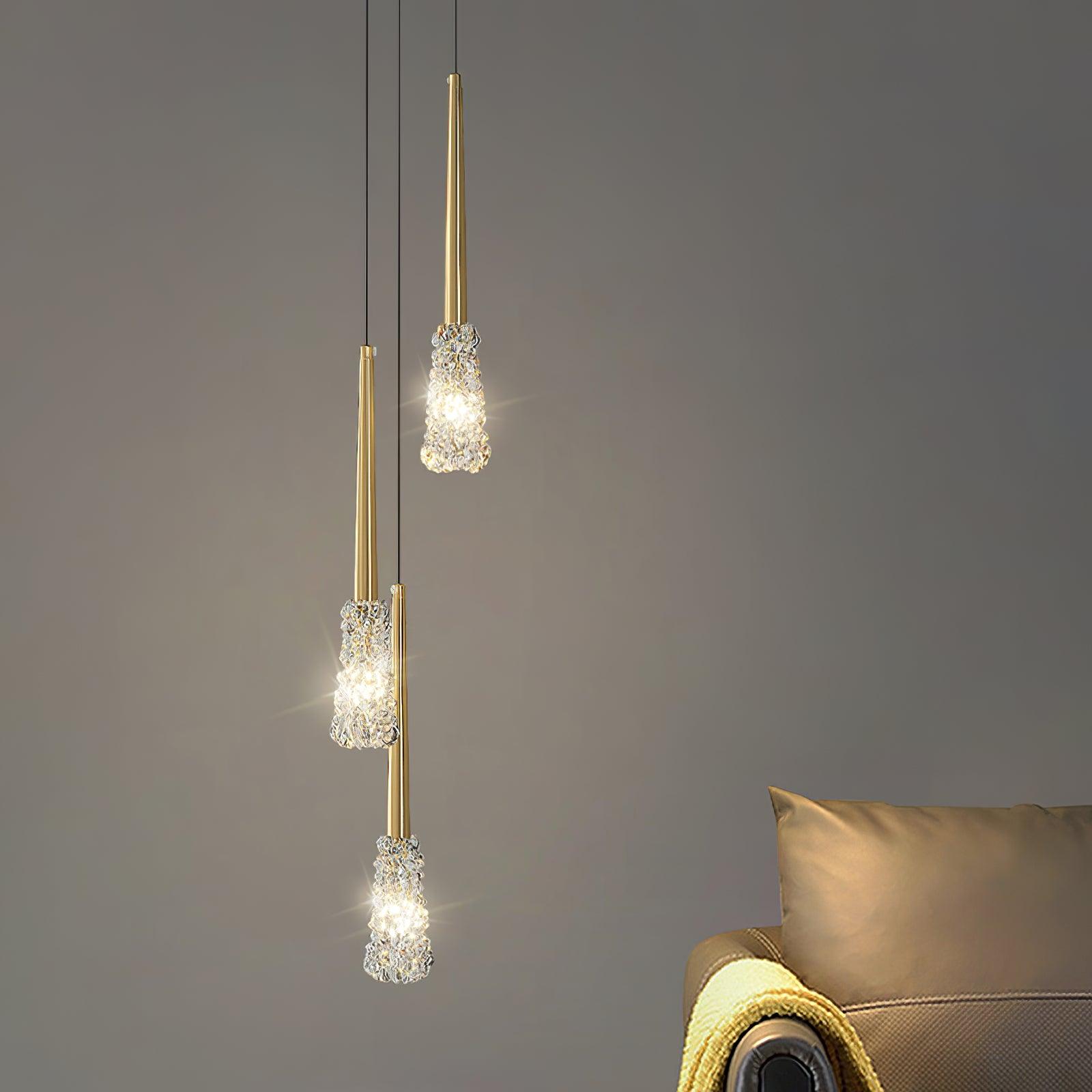 Three textured pendants near a lounge chair