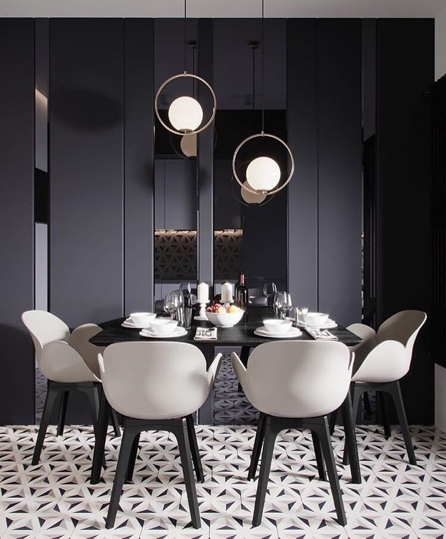 Round frame pendants above a dark dining table