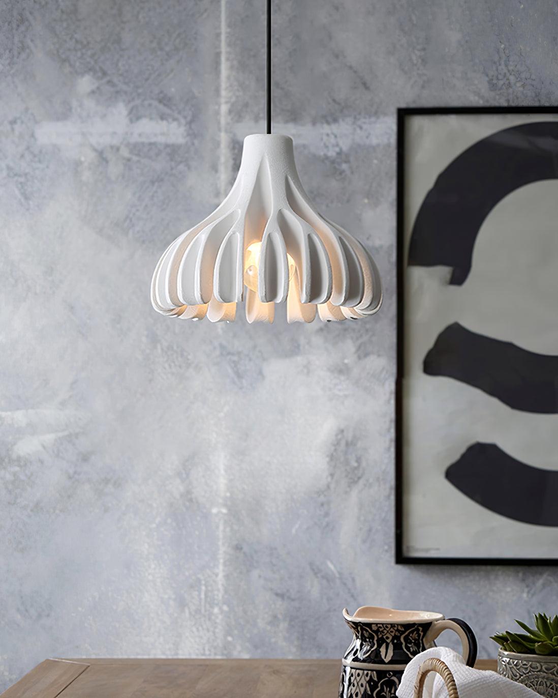 White open ribbed pendant beside wall art