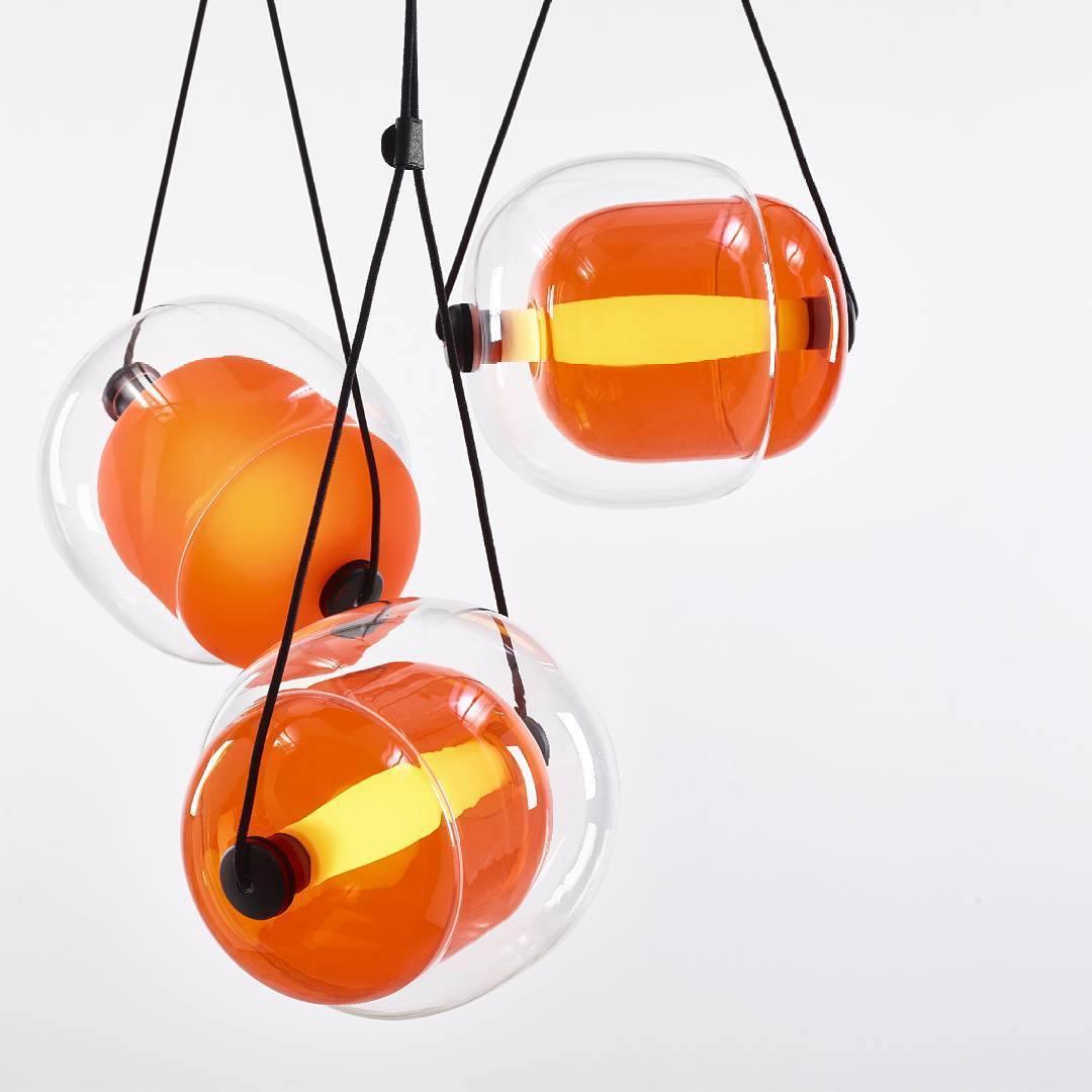 Orange-toned inner glass around luminous tubes