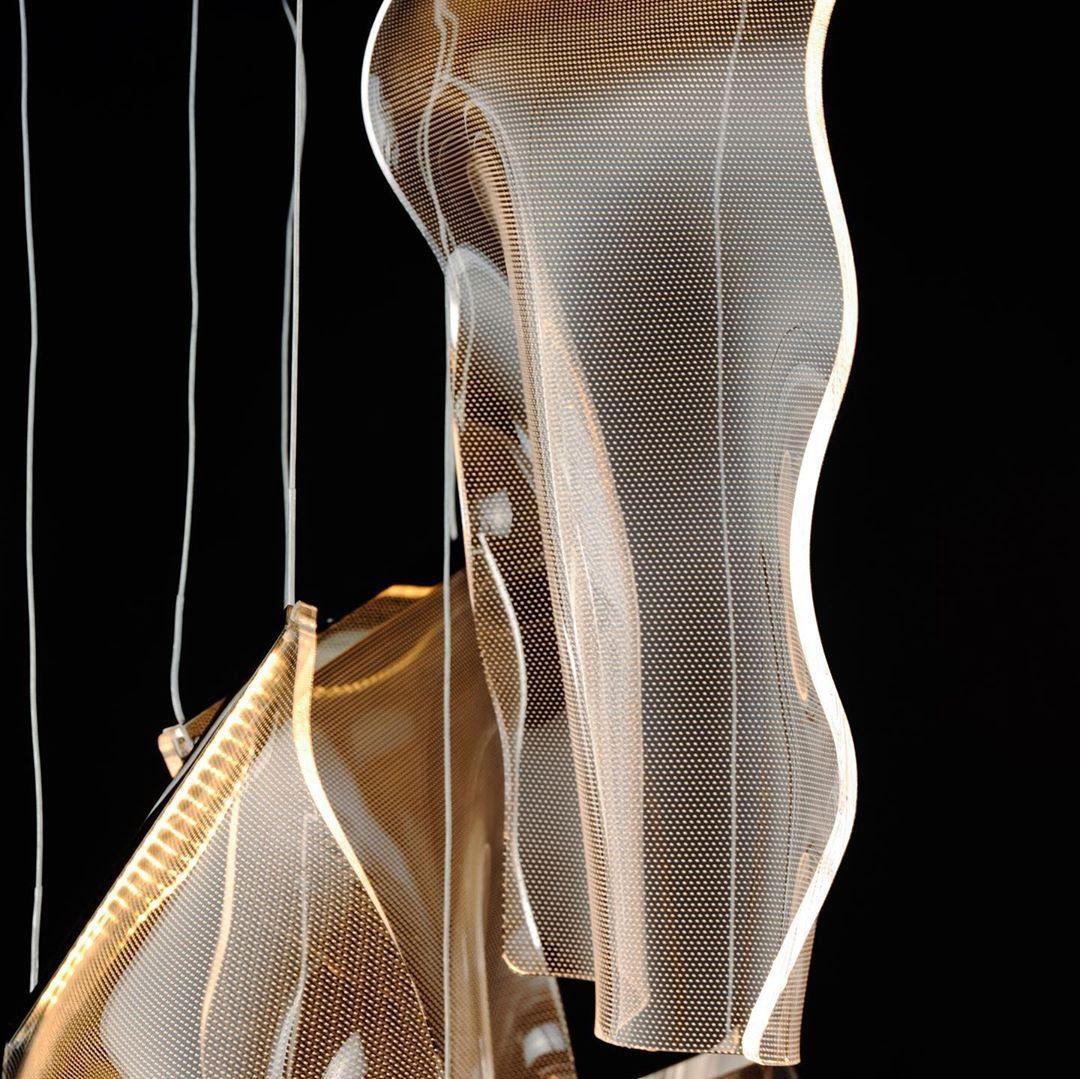 Transparent acrylic sheet hanging from two thin wires