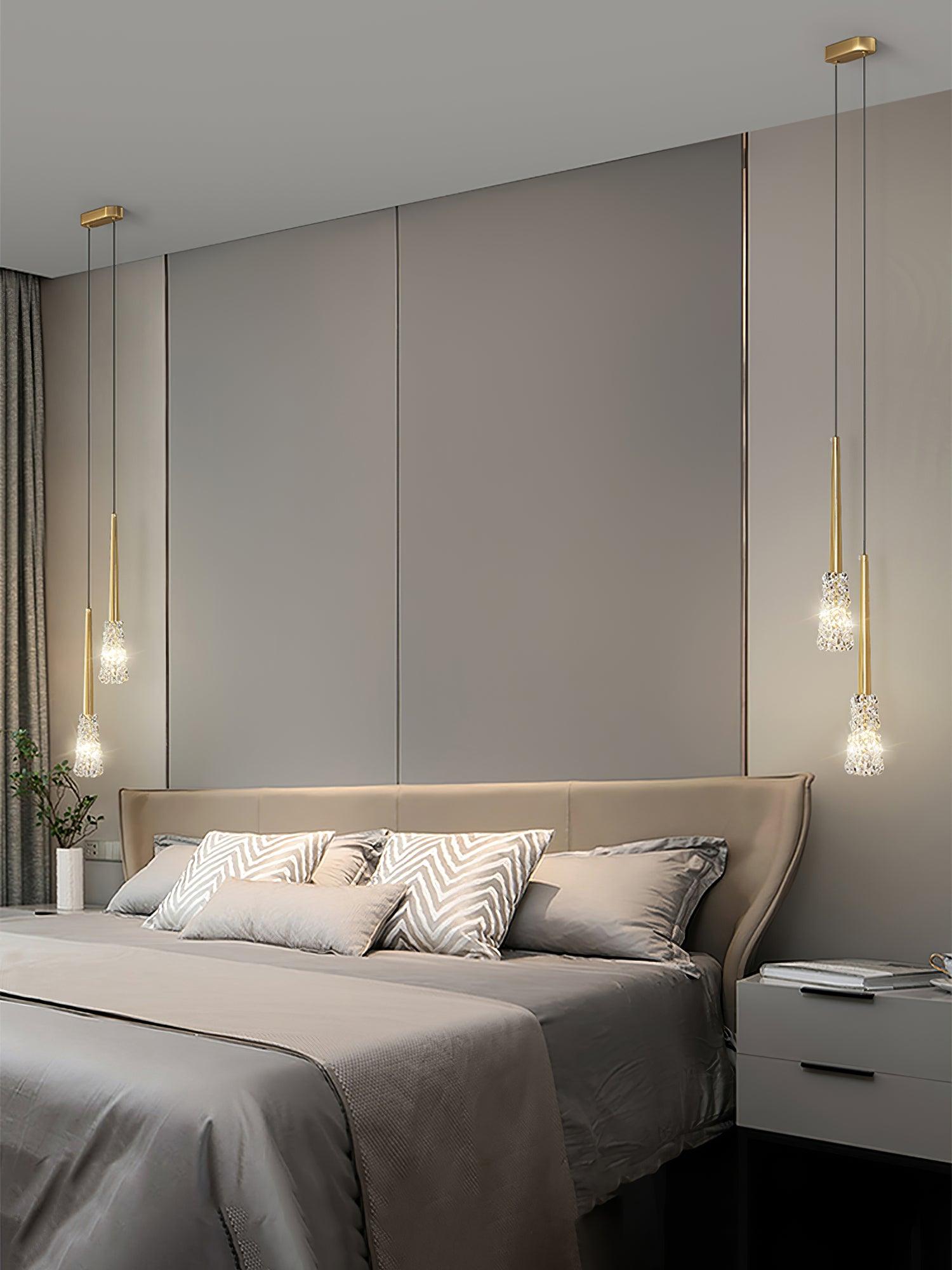 Two-head Gold fixtures beside a bed