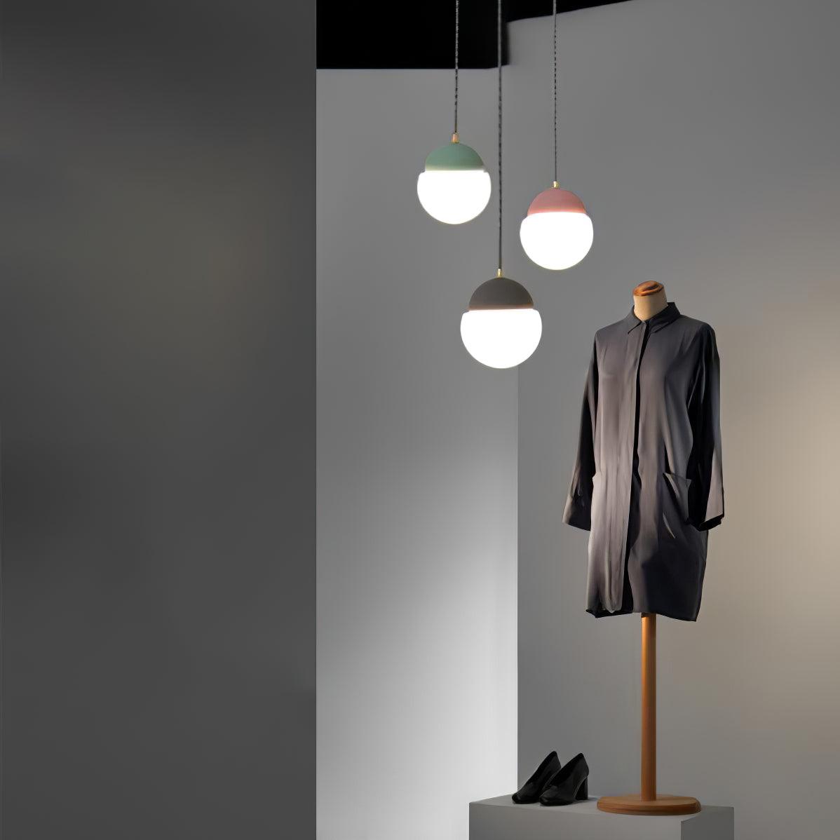 Three coloured globe pendants in an entrance
