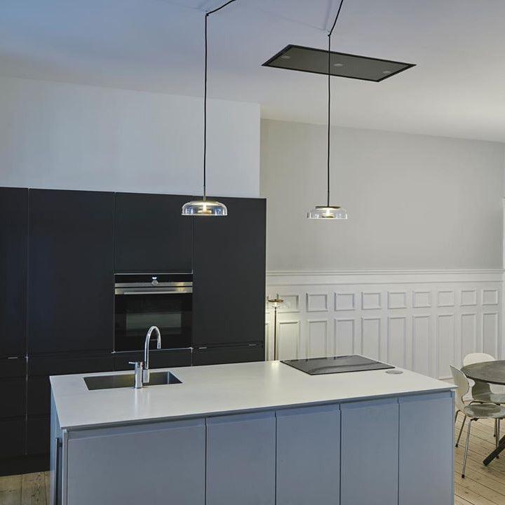 Blossi pendant light with a glass dome and circular inner metal elements