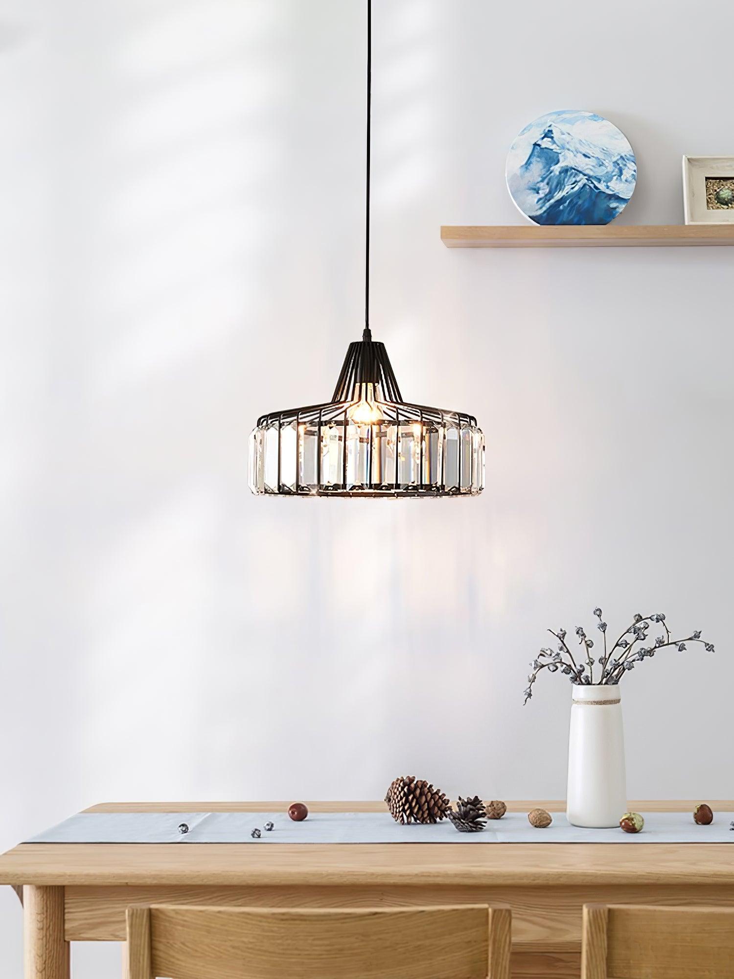 Black drum pendant above a wooden console