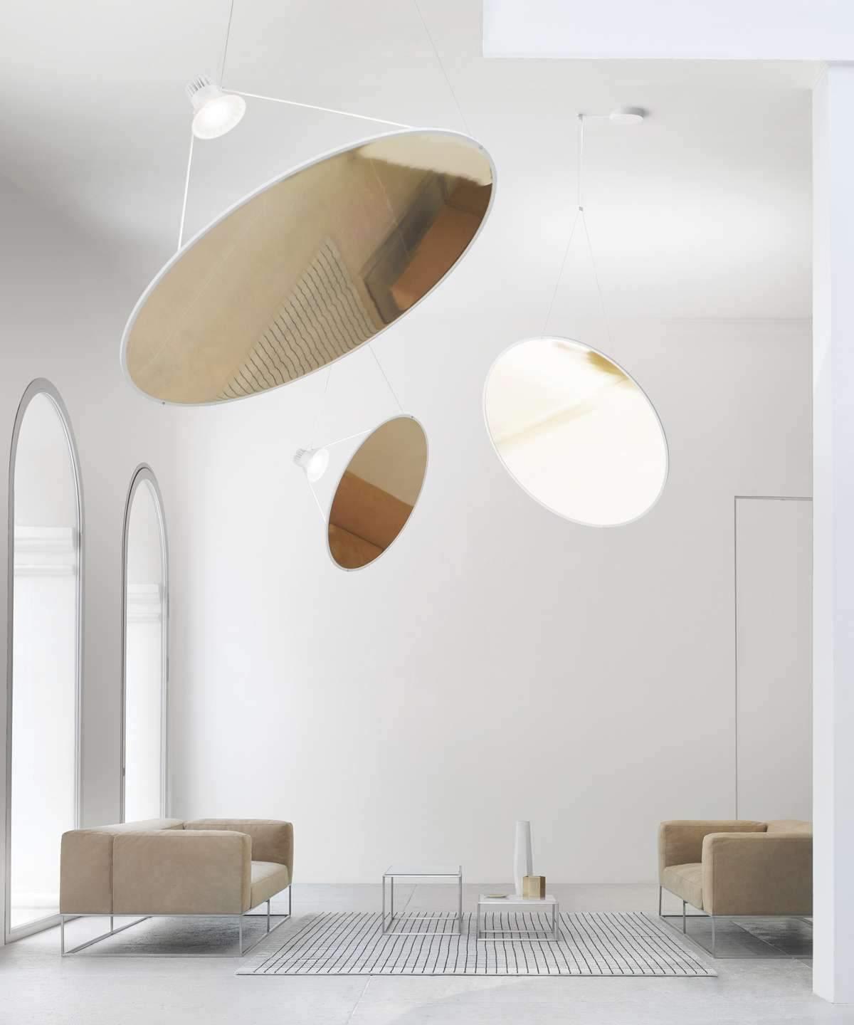 Circular reflective discs in a high-ceiling room