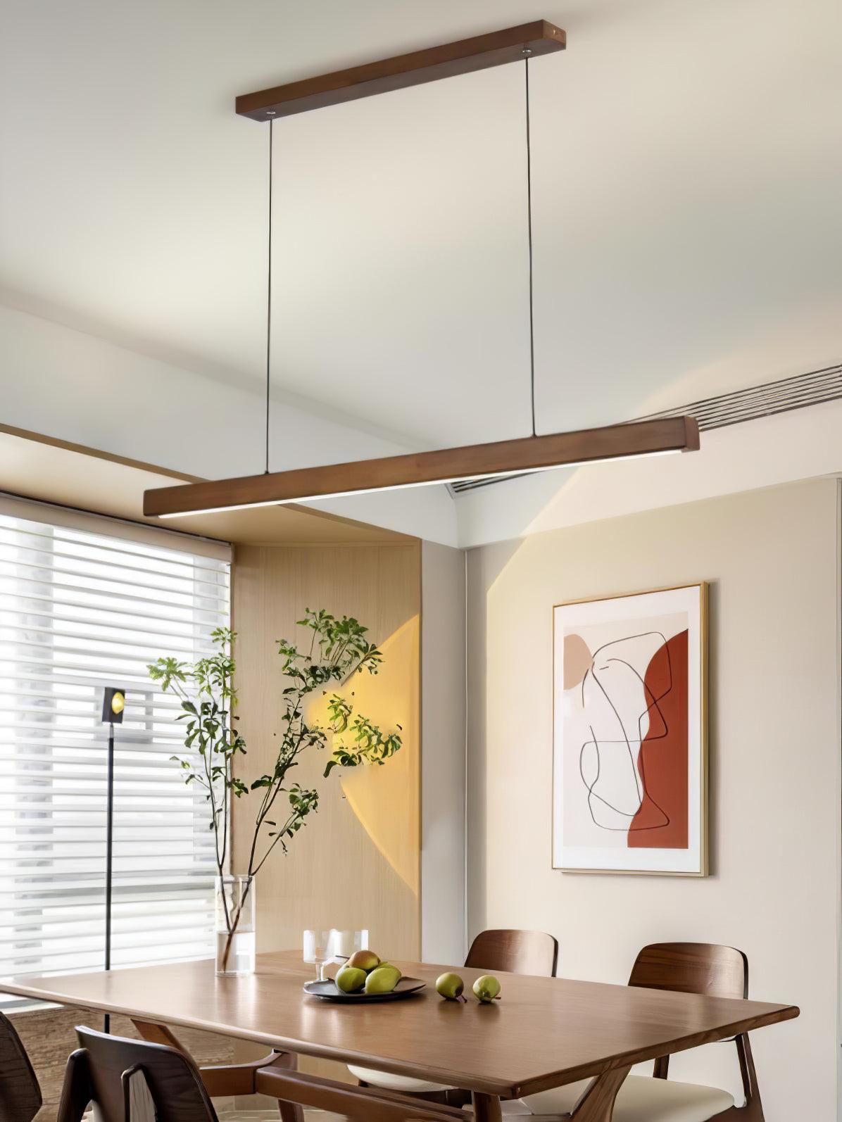 Angled Walnut-colour pendant above a dining setting