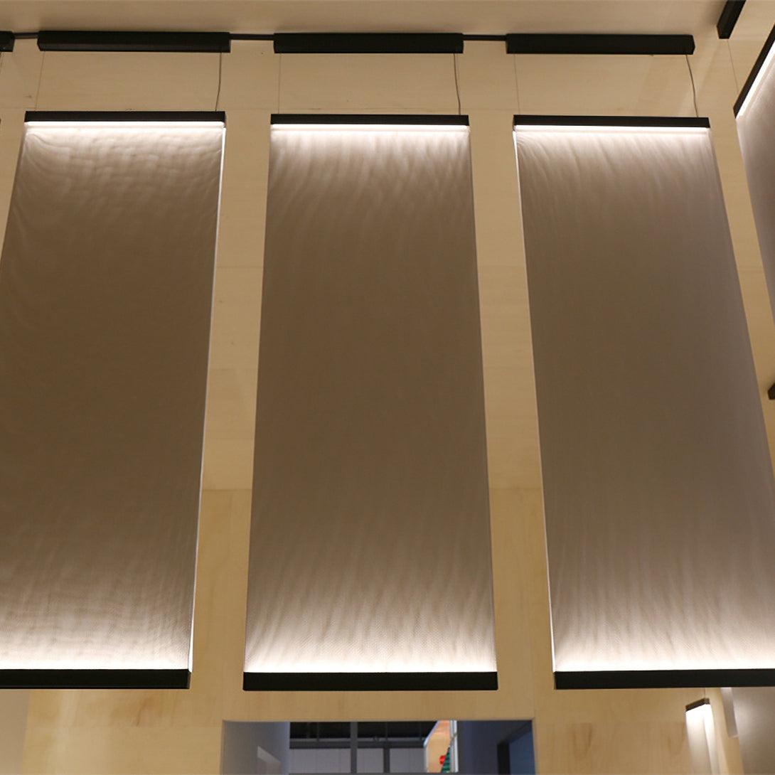 Tall illuminated fabric beneath dark upper rails