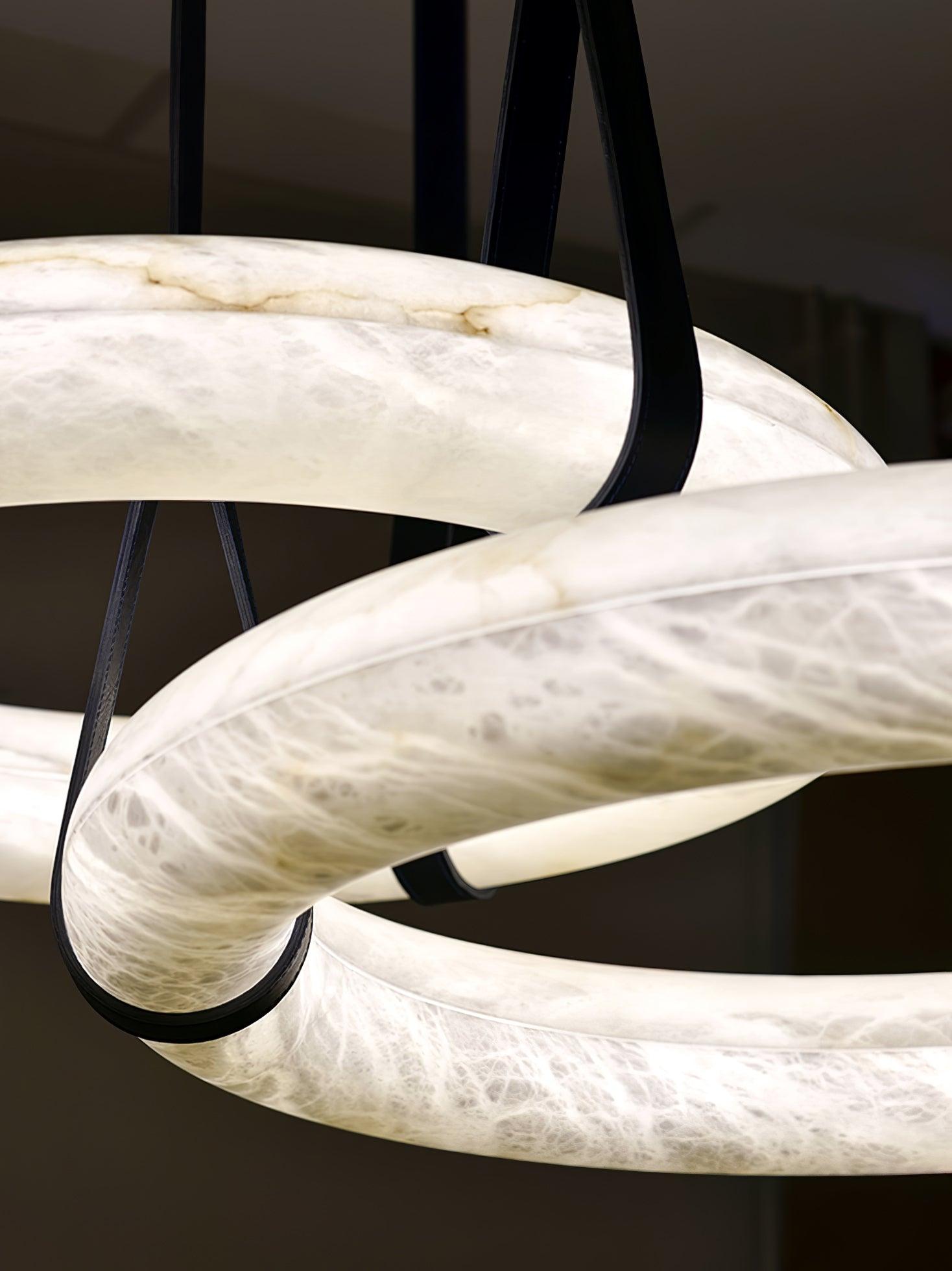 Two ring pendants with dark straps in close-up