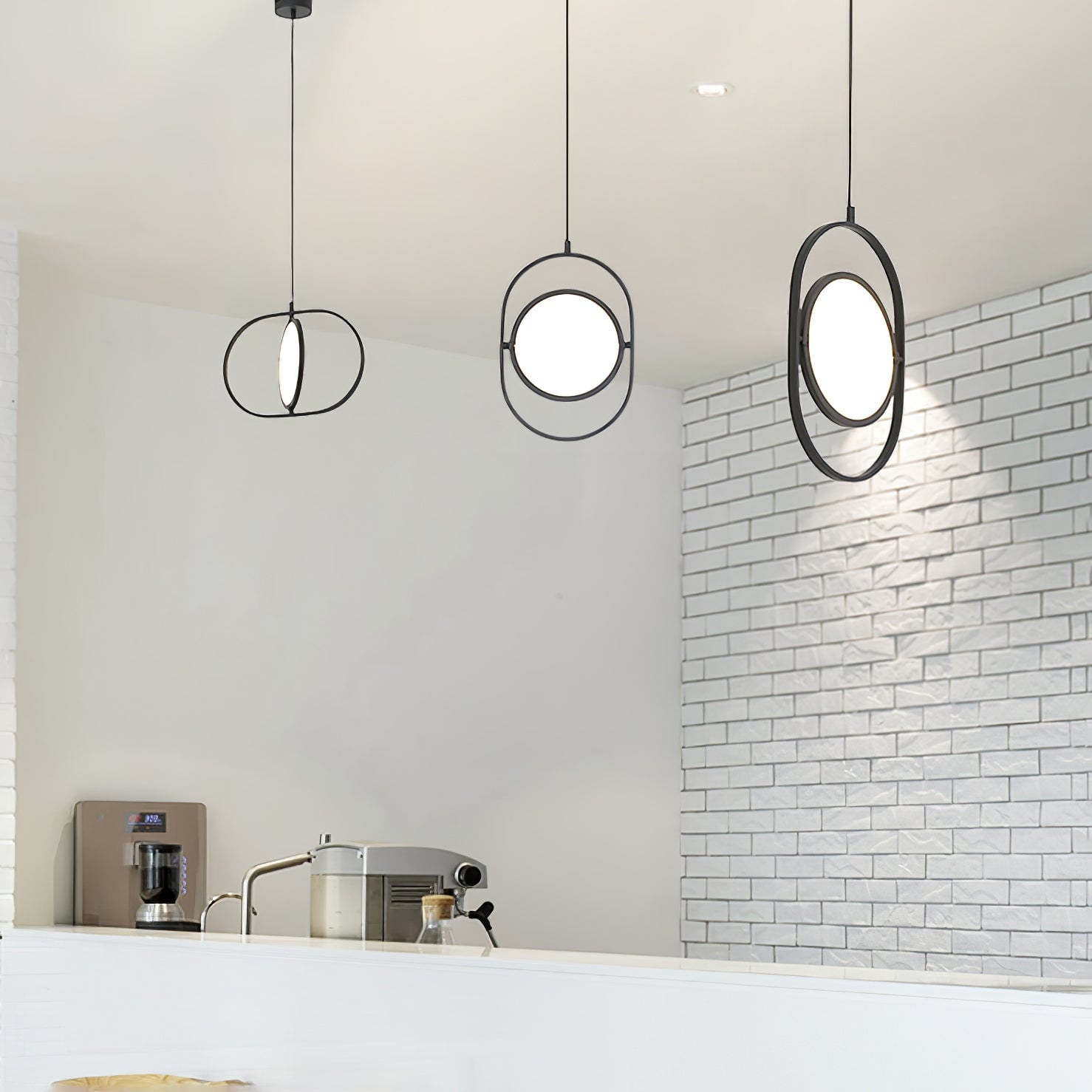Three KUU pendants above a white counter