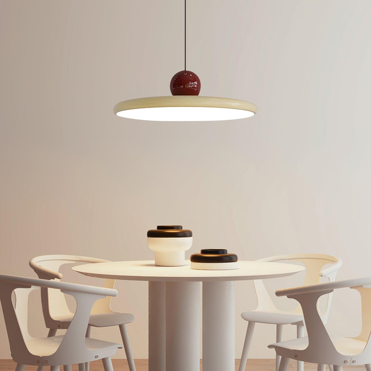 Lola red sphere and beige disc above a pale dining set