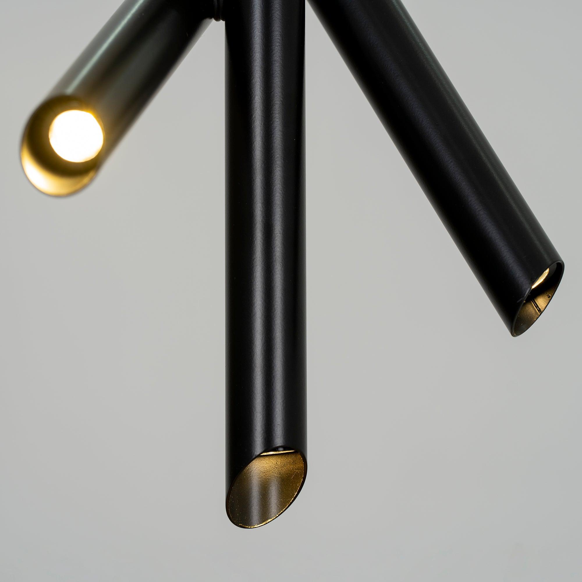 Underside view of the black Tubes pendant showing its tubular ends and recessed lights