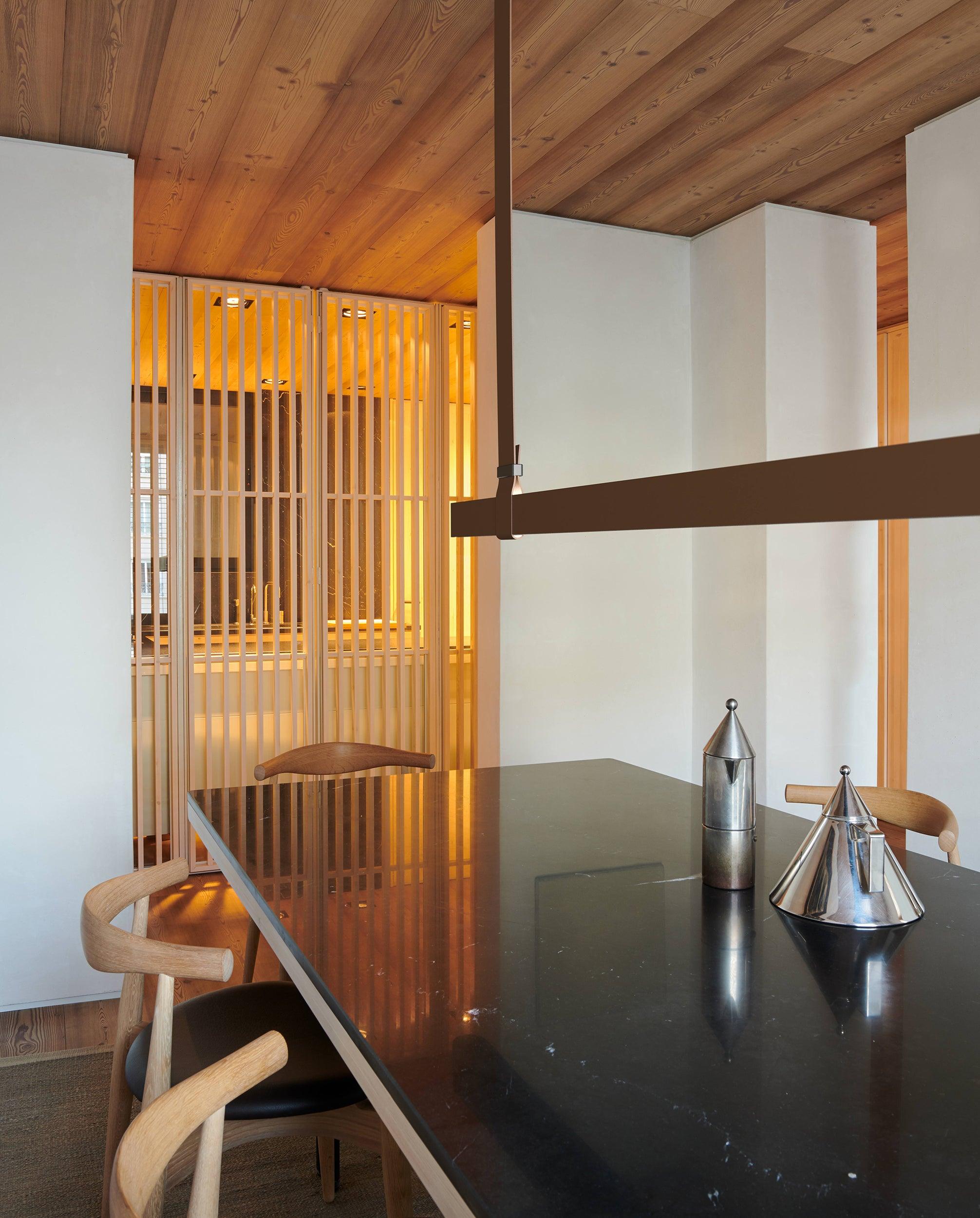 Brown horizontal profile beside a wooden wall