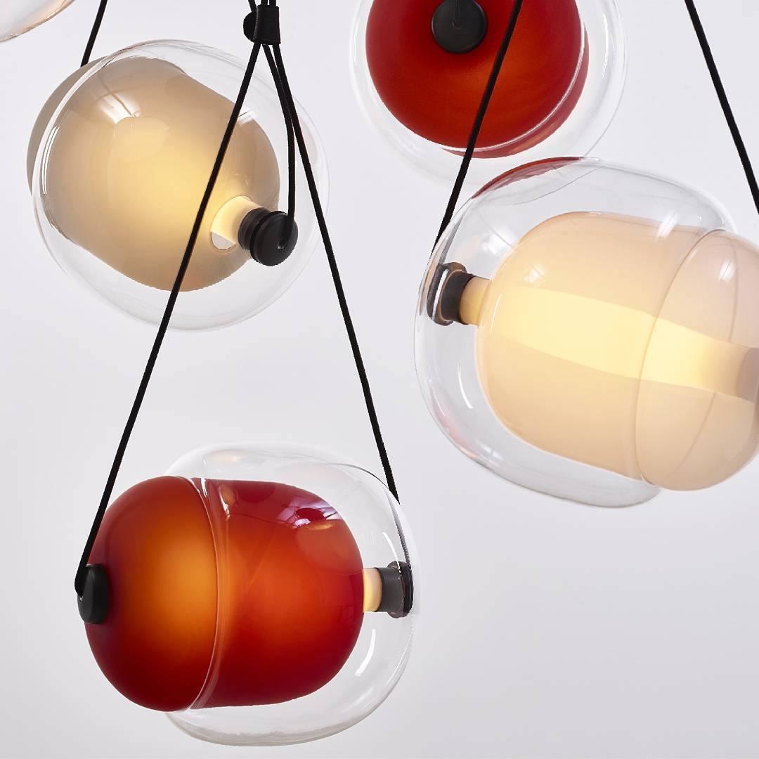 Opaline and red-toned capsule pendants