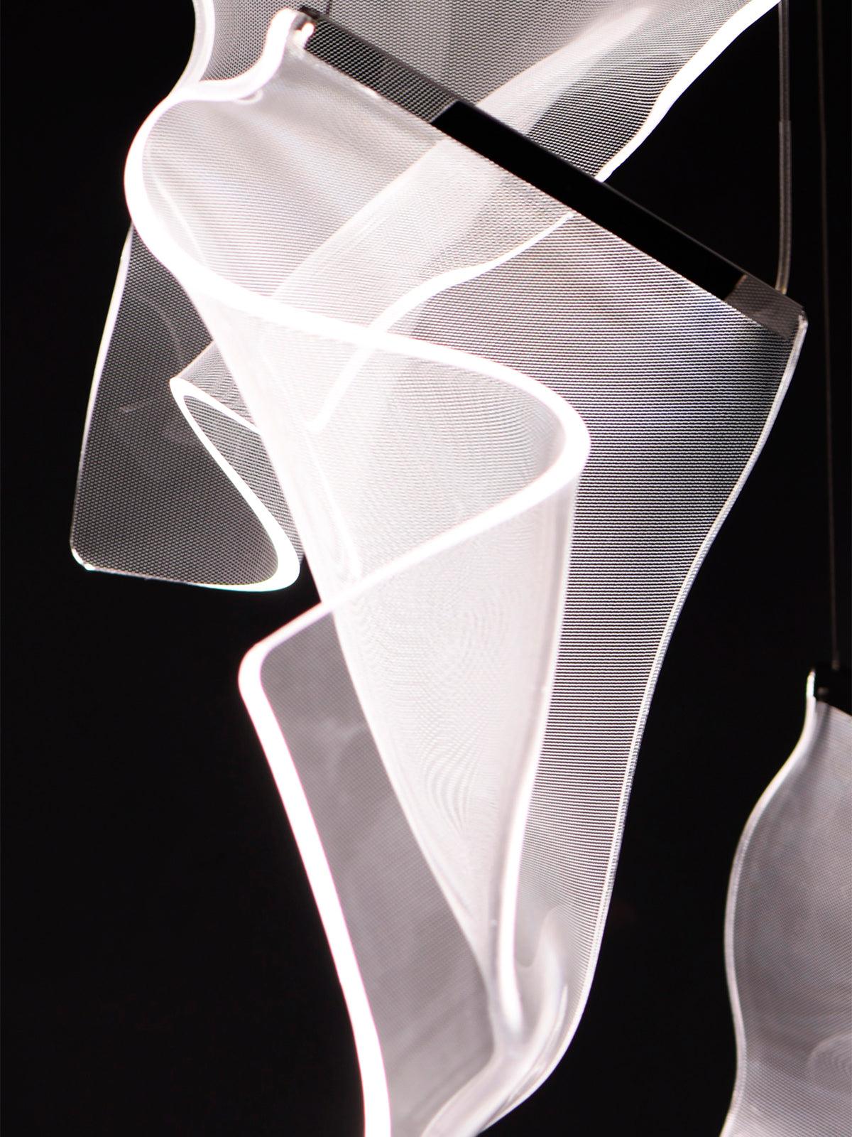 Bright curved edges of a white-lit acrylic element
