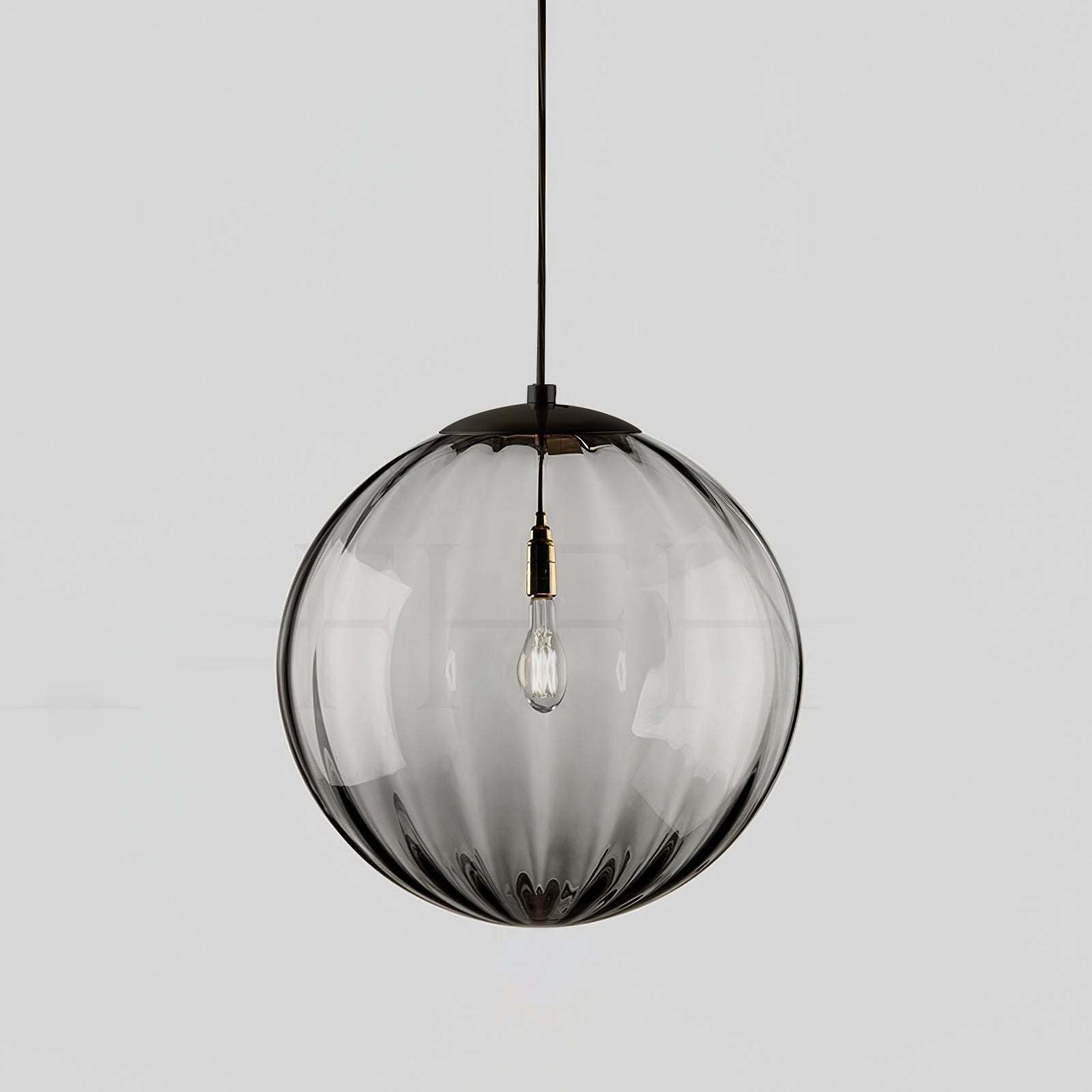 Paola pendant light with a coloured glass globe and small metal cap
