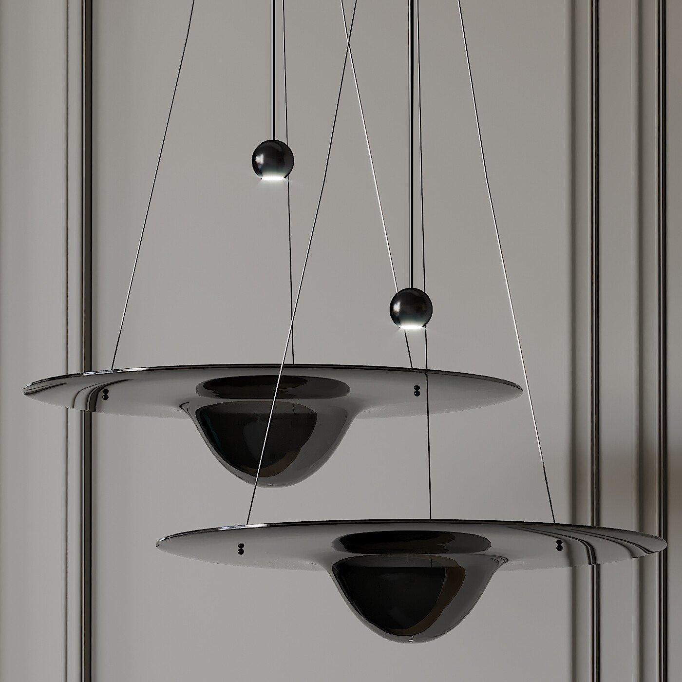 Two dark mirror-like glass disc pendants with rounded central bowls and reflective beads