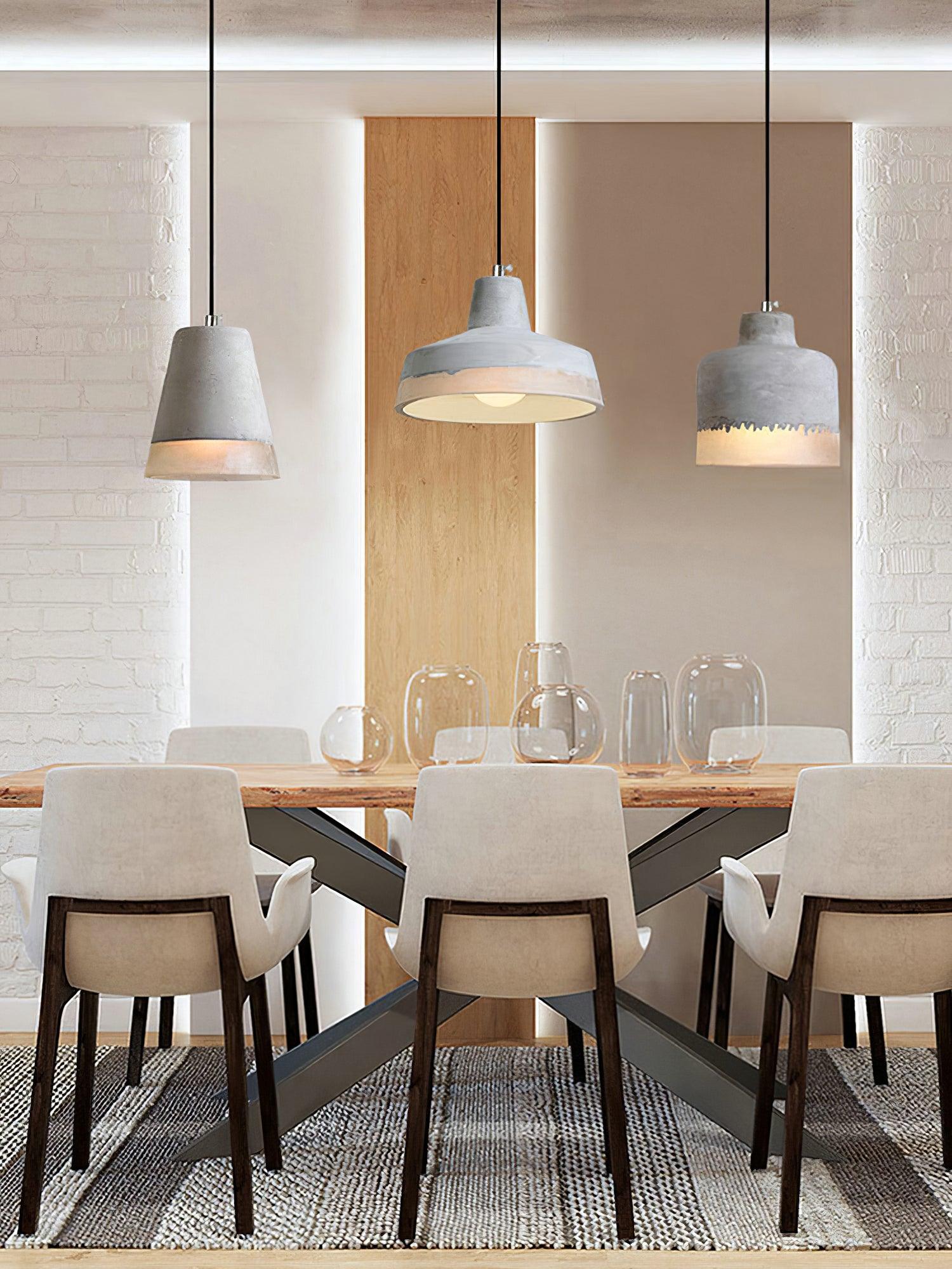 Three Delia pendants above a dining table